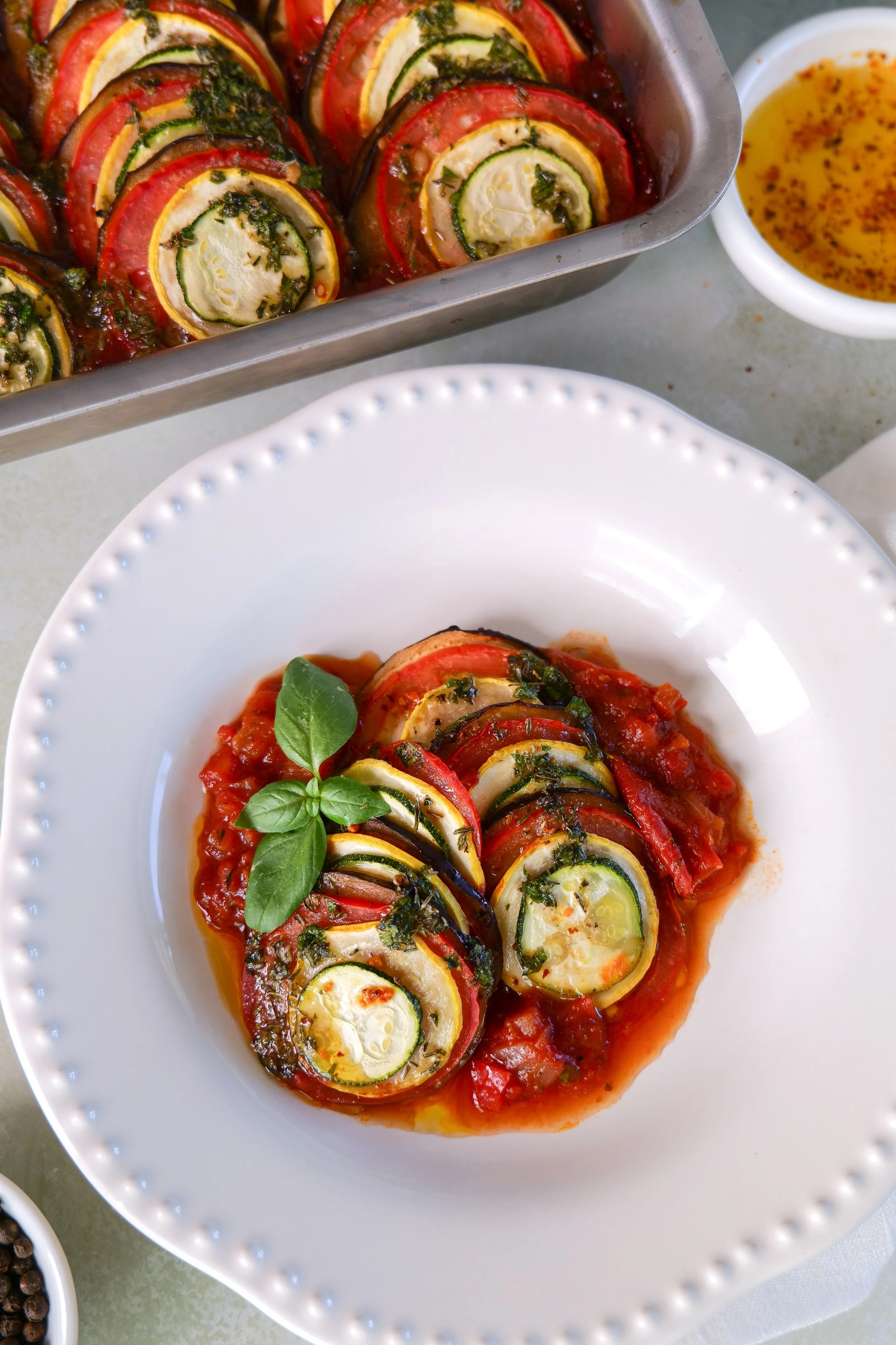 Seasonal summer vegetables arranged on a countertop before making classic French ratatouille.