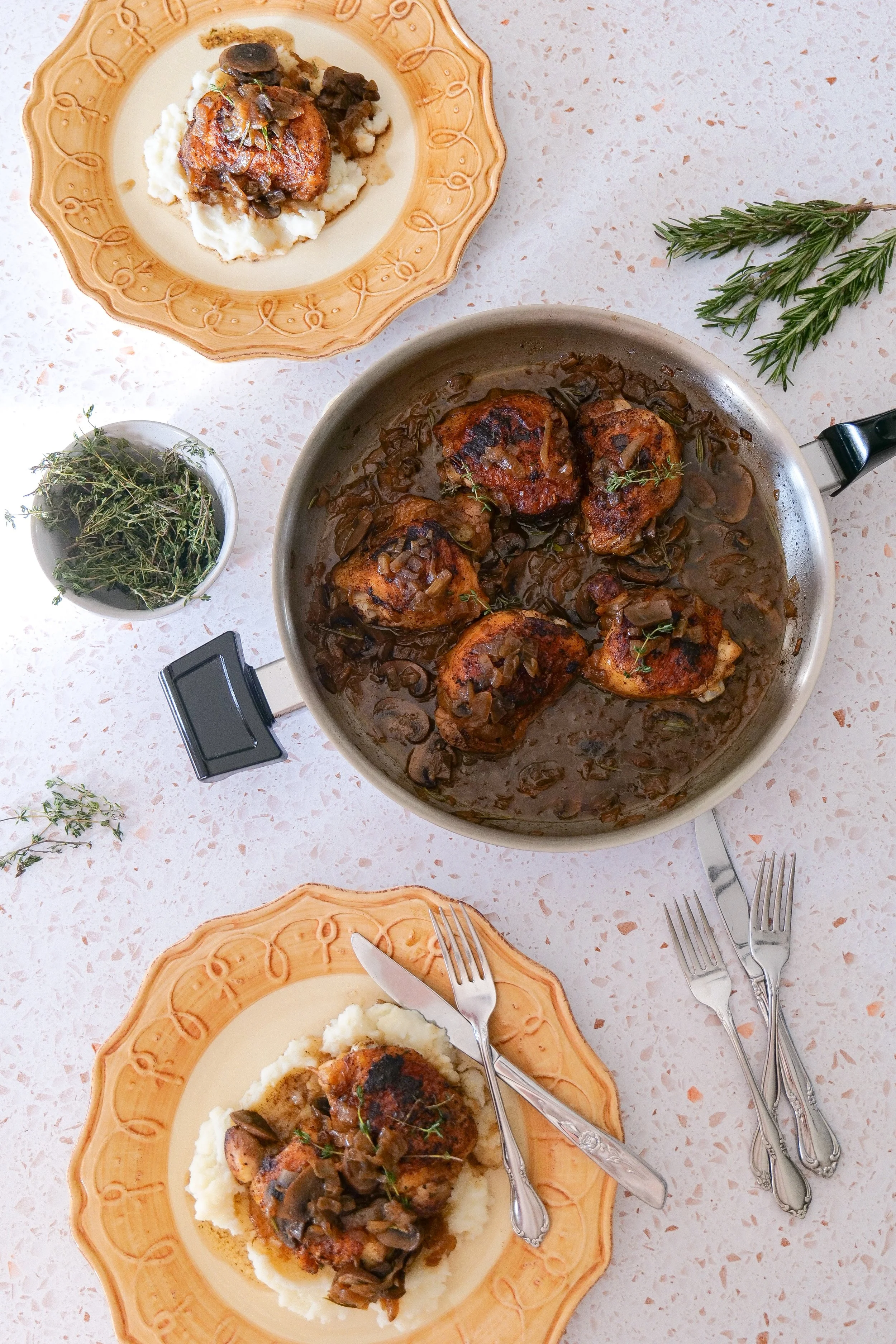 Easy skillet mushroom chicken dinner made with bone-in chicken thighs and caramelized onions.