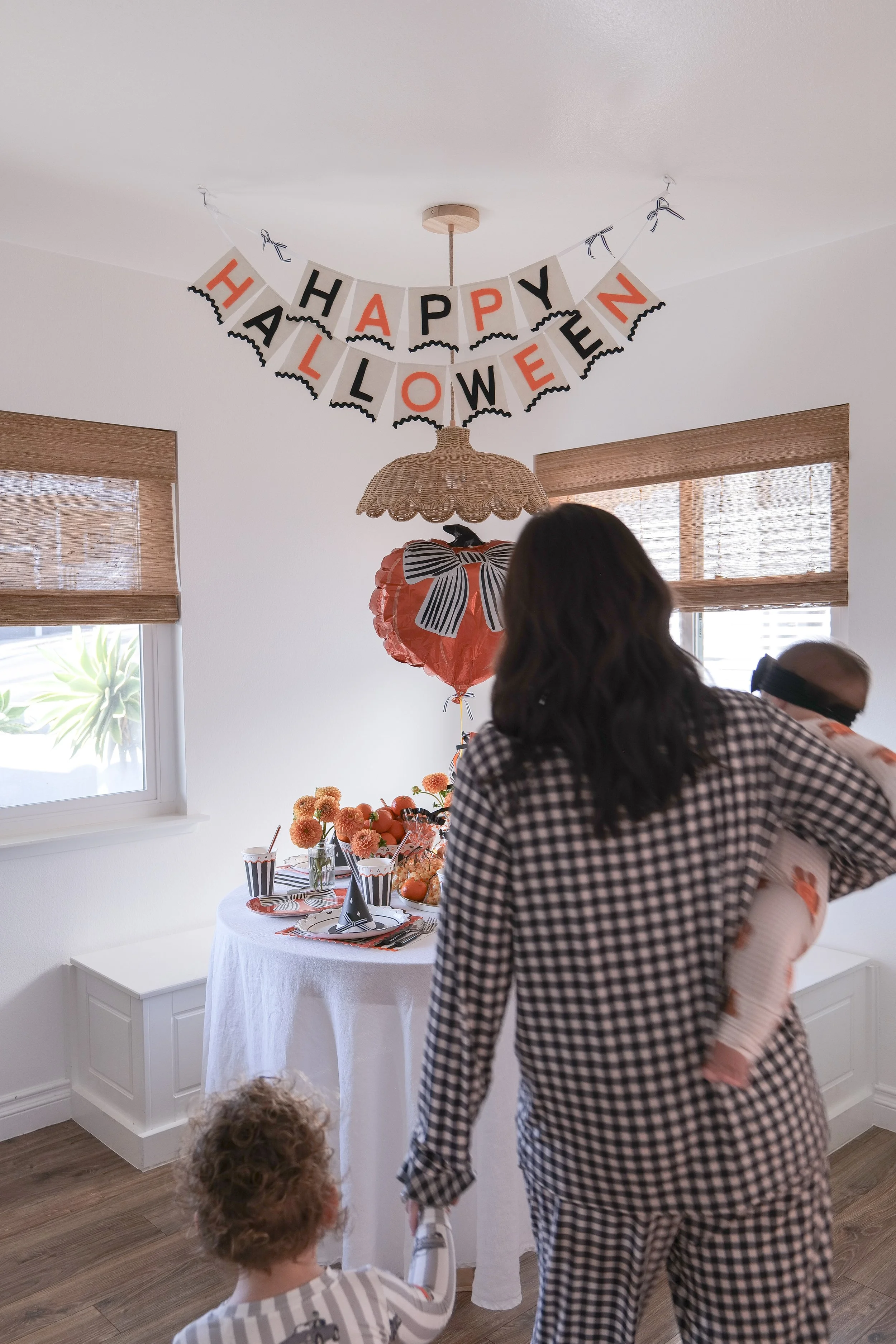 Family enjoying a festive Halloween breakfast tradition at home.