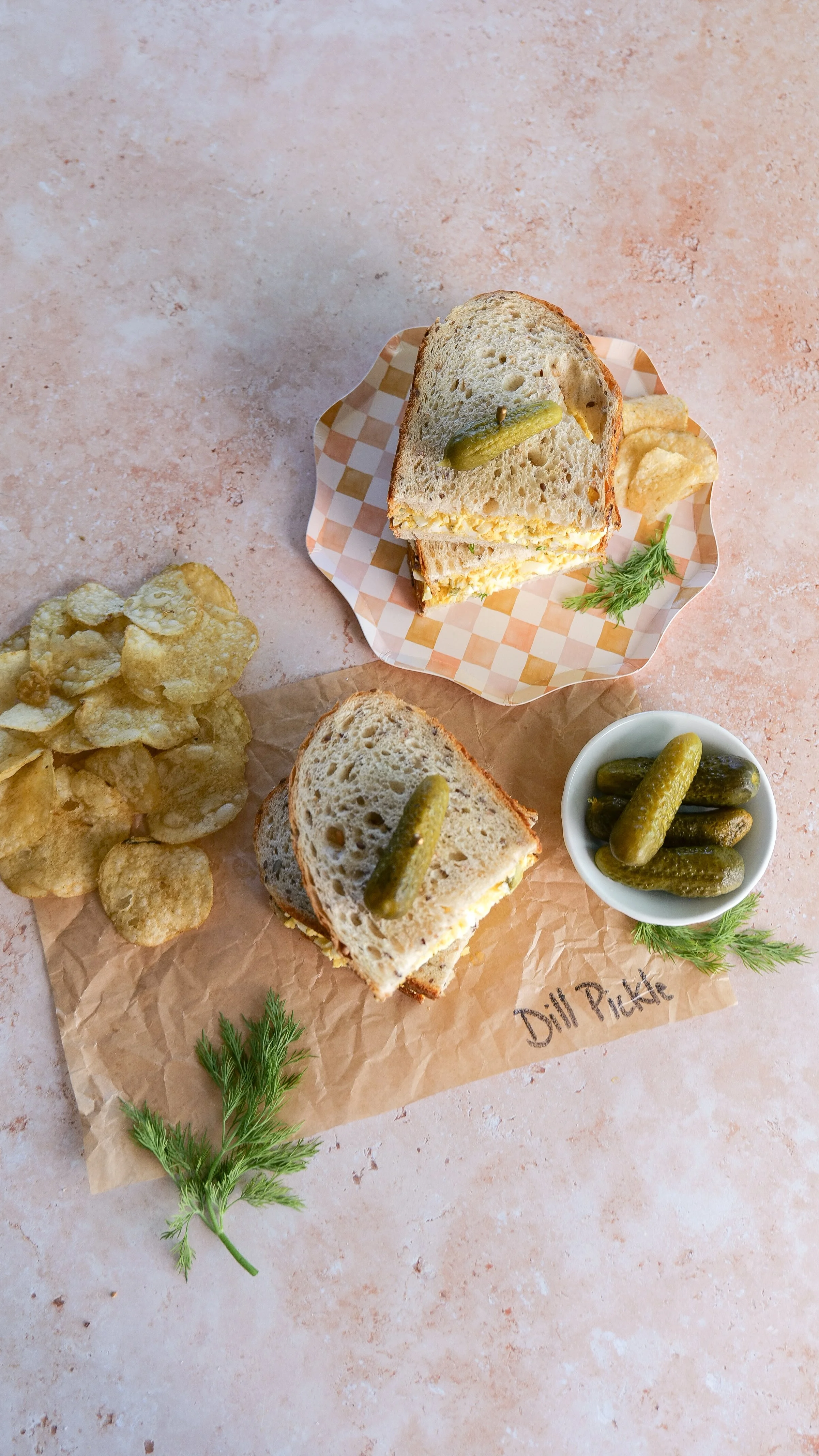 Creamy egg salad with crunchy dill pickle pieces and fresh dill.