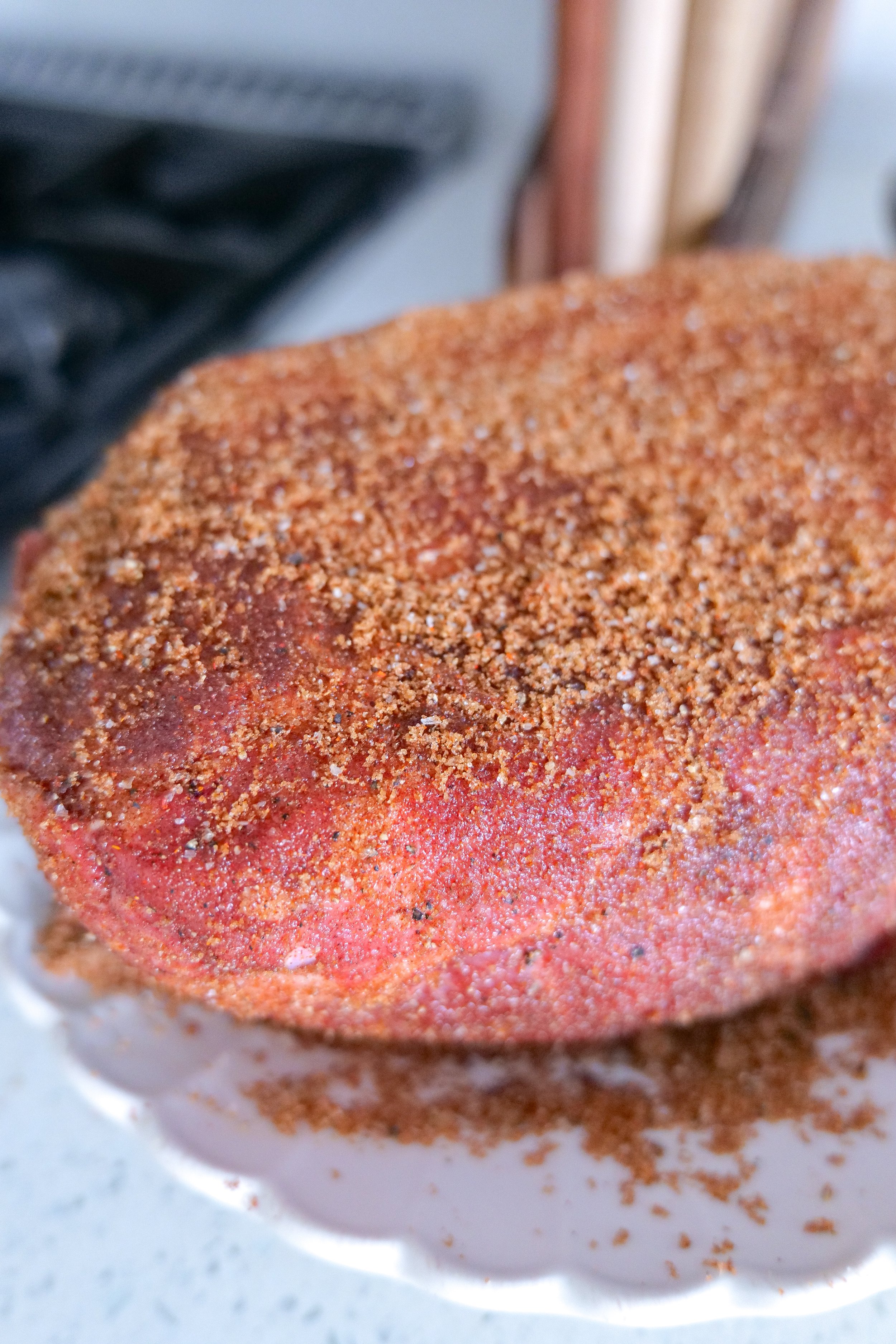 Pork shoulder coated in homemade brown sugar dry rub and placed in the slow cooker.