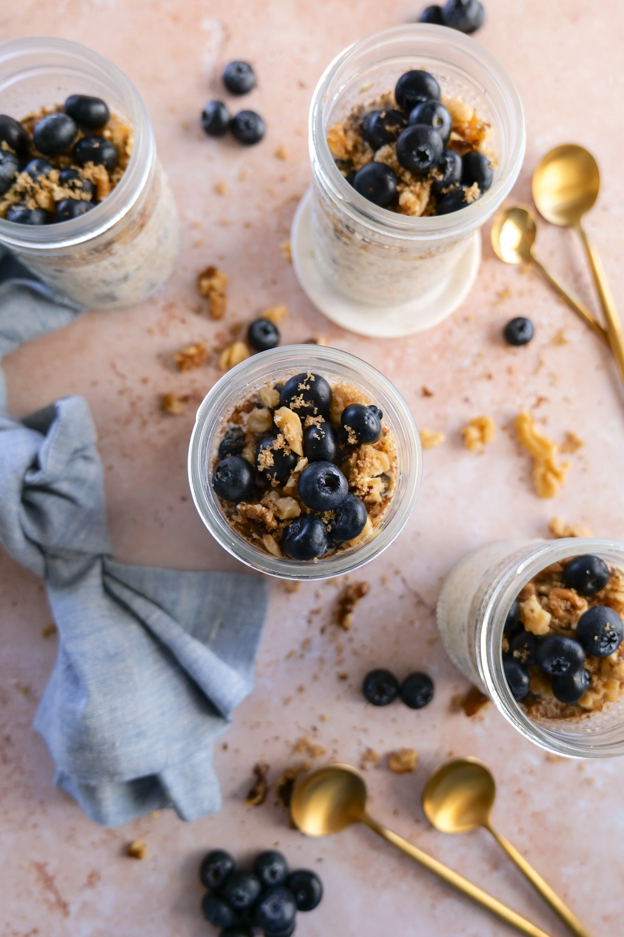 Fresh blueberries folded into overnight oats before refrigerating.