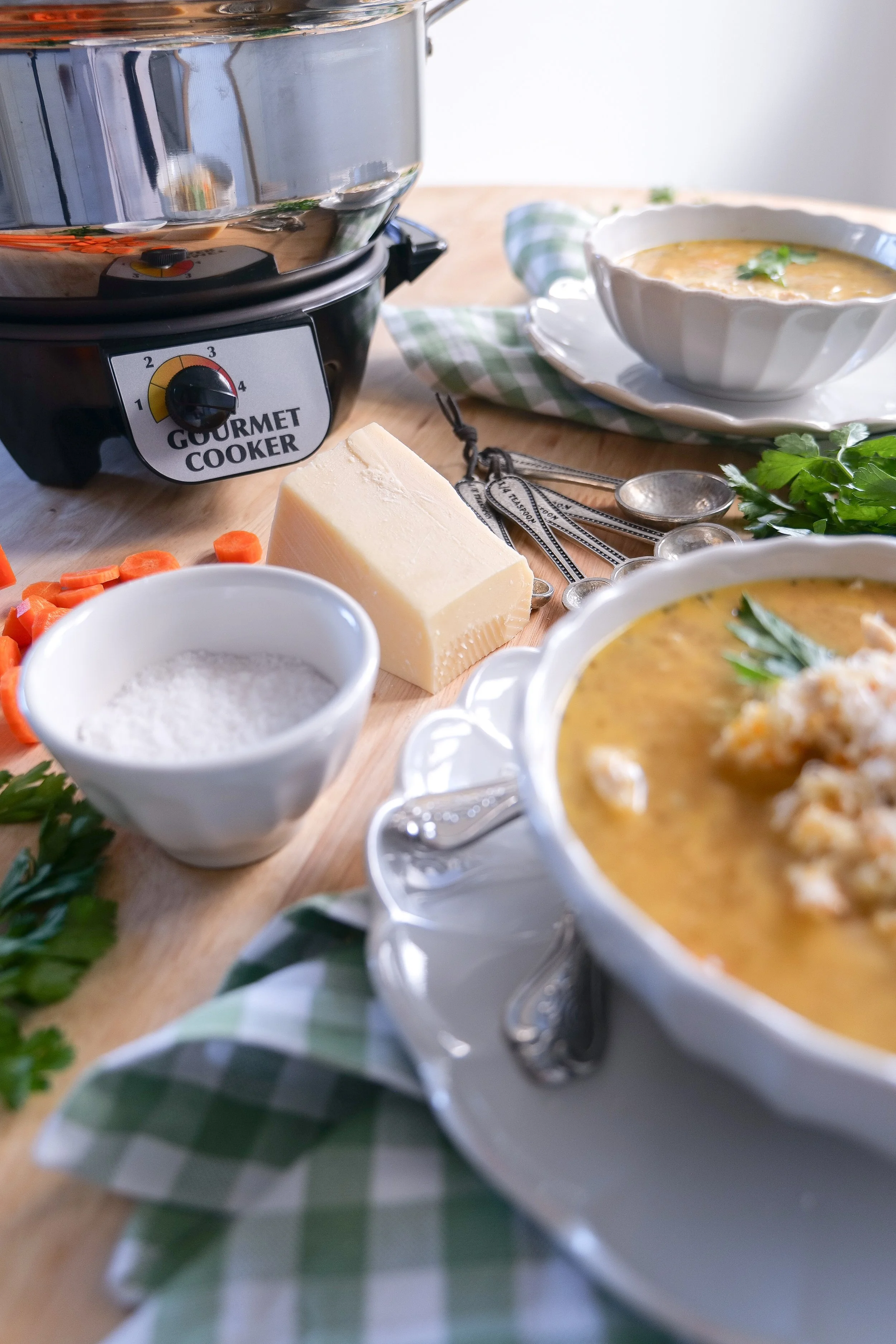 Homemade Italian chicken soup topped with Parmesan cheese and fresh chopped parsley.