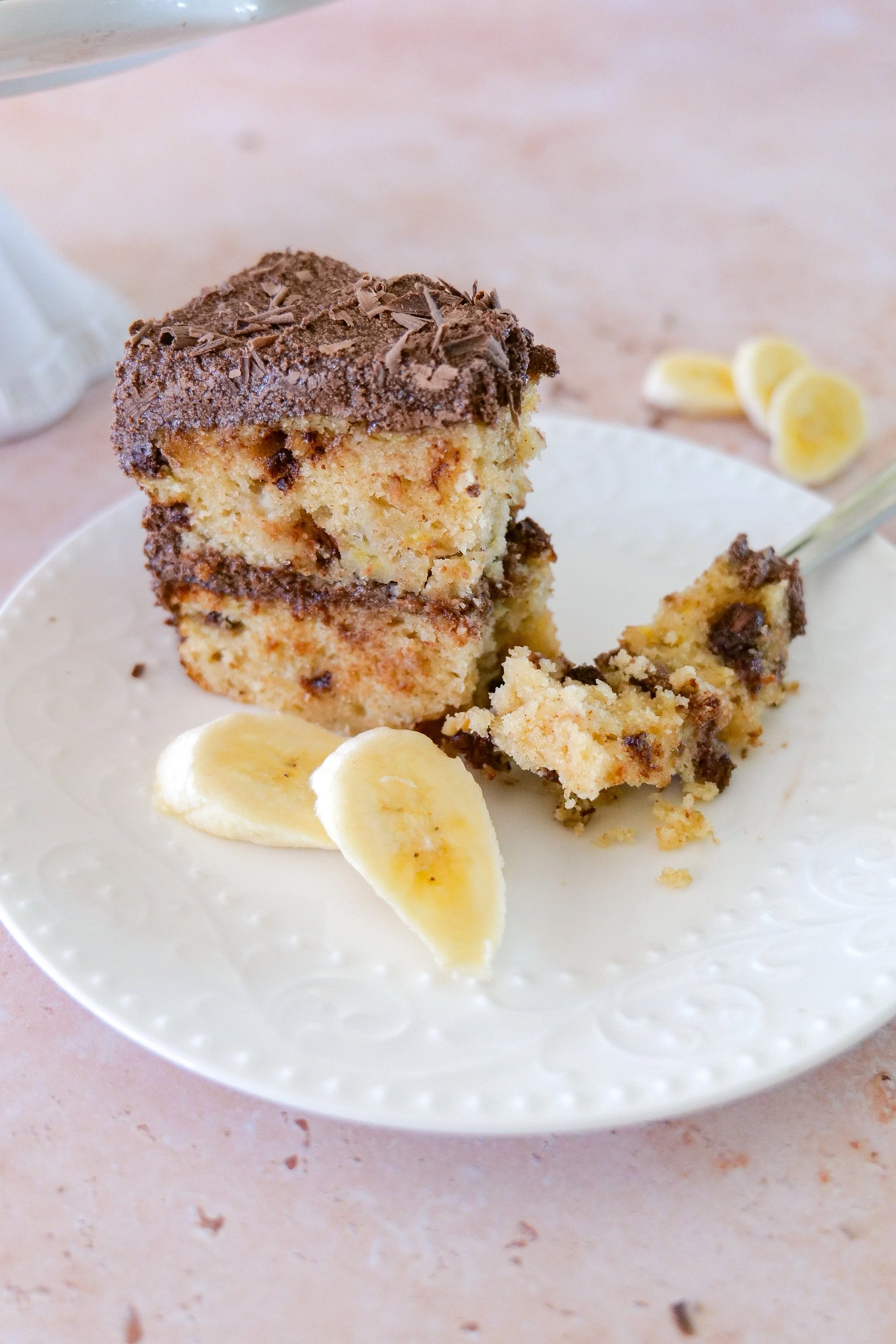 Moist banana cake with chocolate chips and rich chocolate ganache frosting.