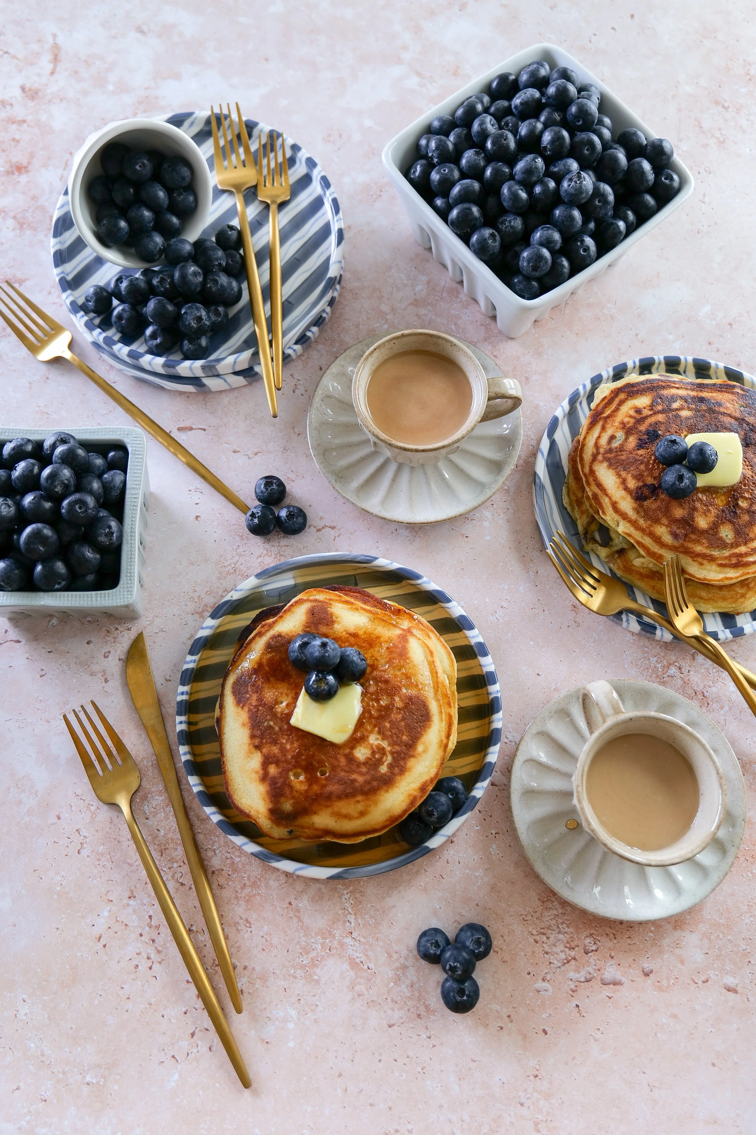 Easy sourdough pancake recipe with juicy blueberries folded into the batter.