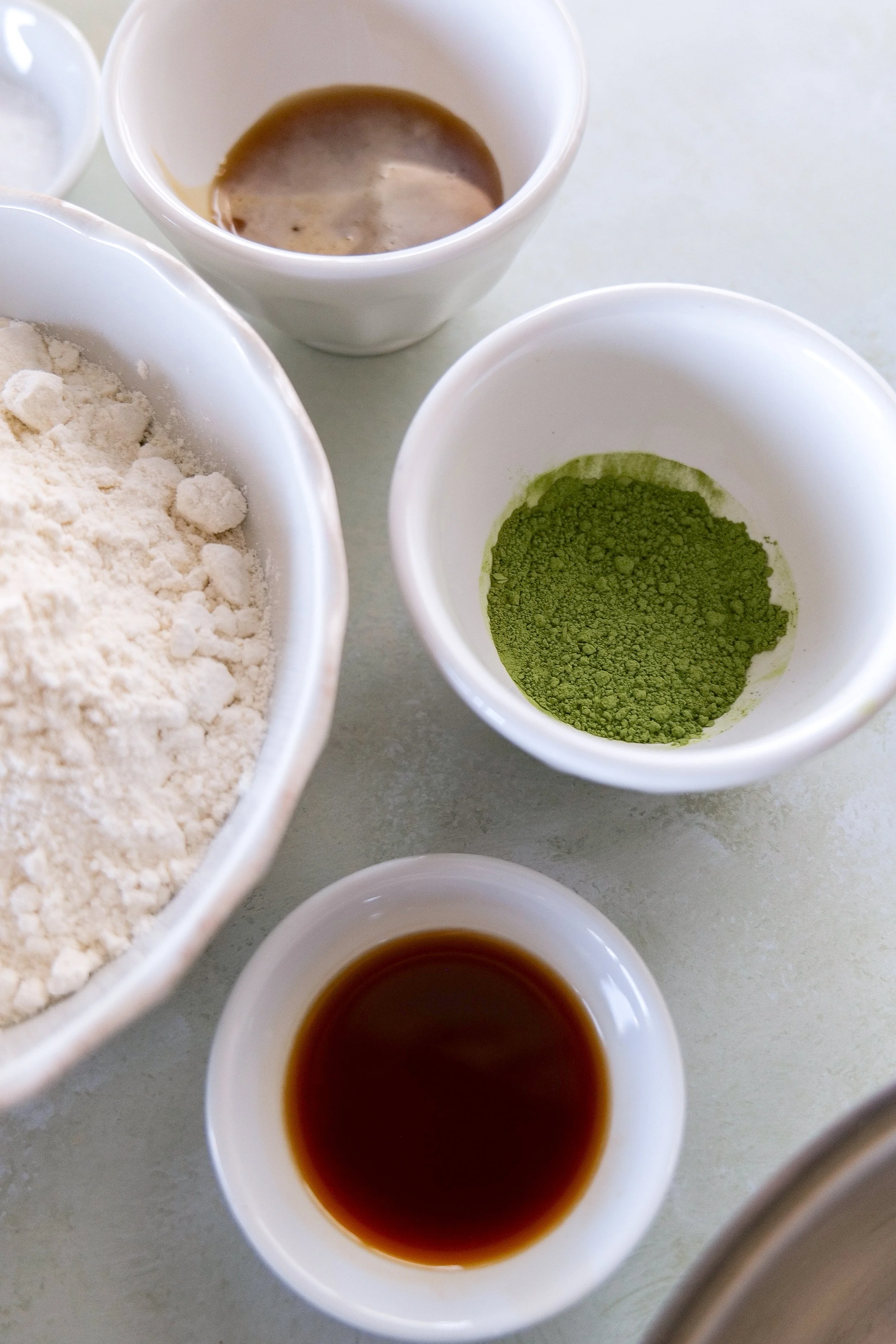 Bowl of matcha sourdough discard pancake ingredients