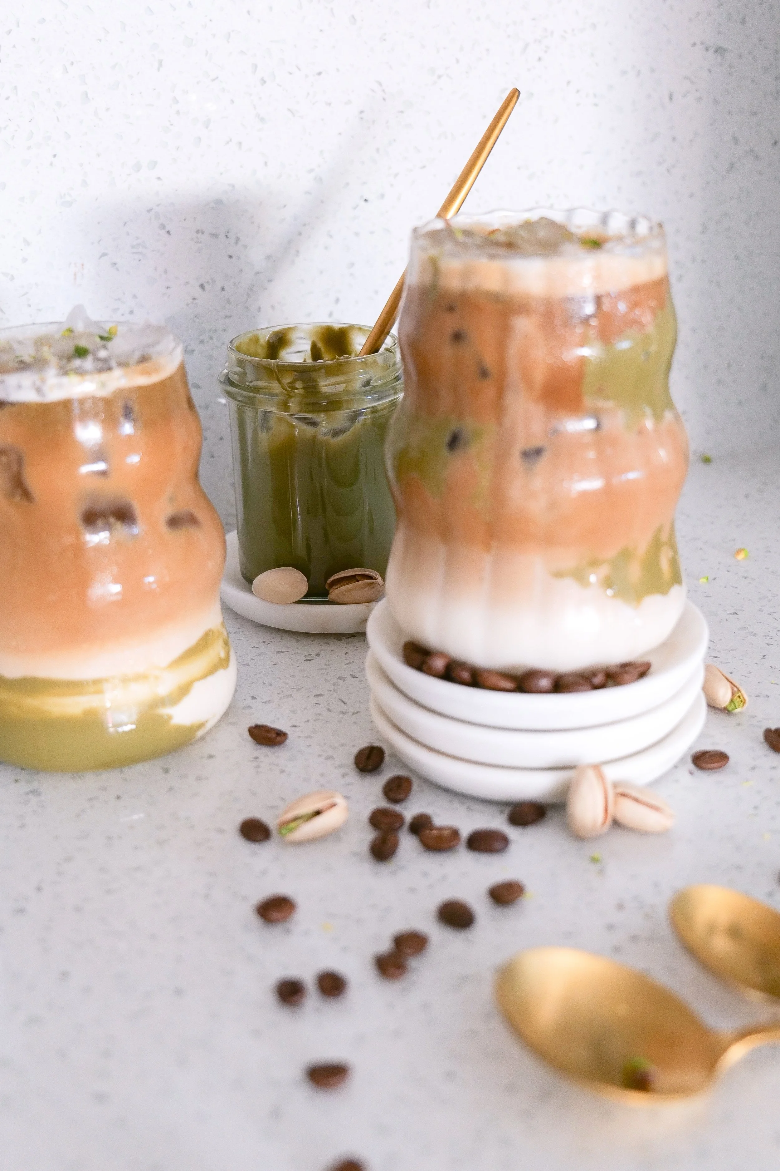 Iced espresso drink with pistachio cream and creamy milk for an easy homemade latte.