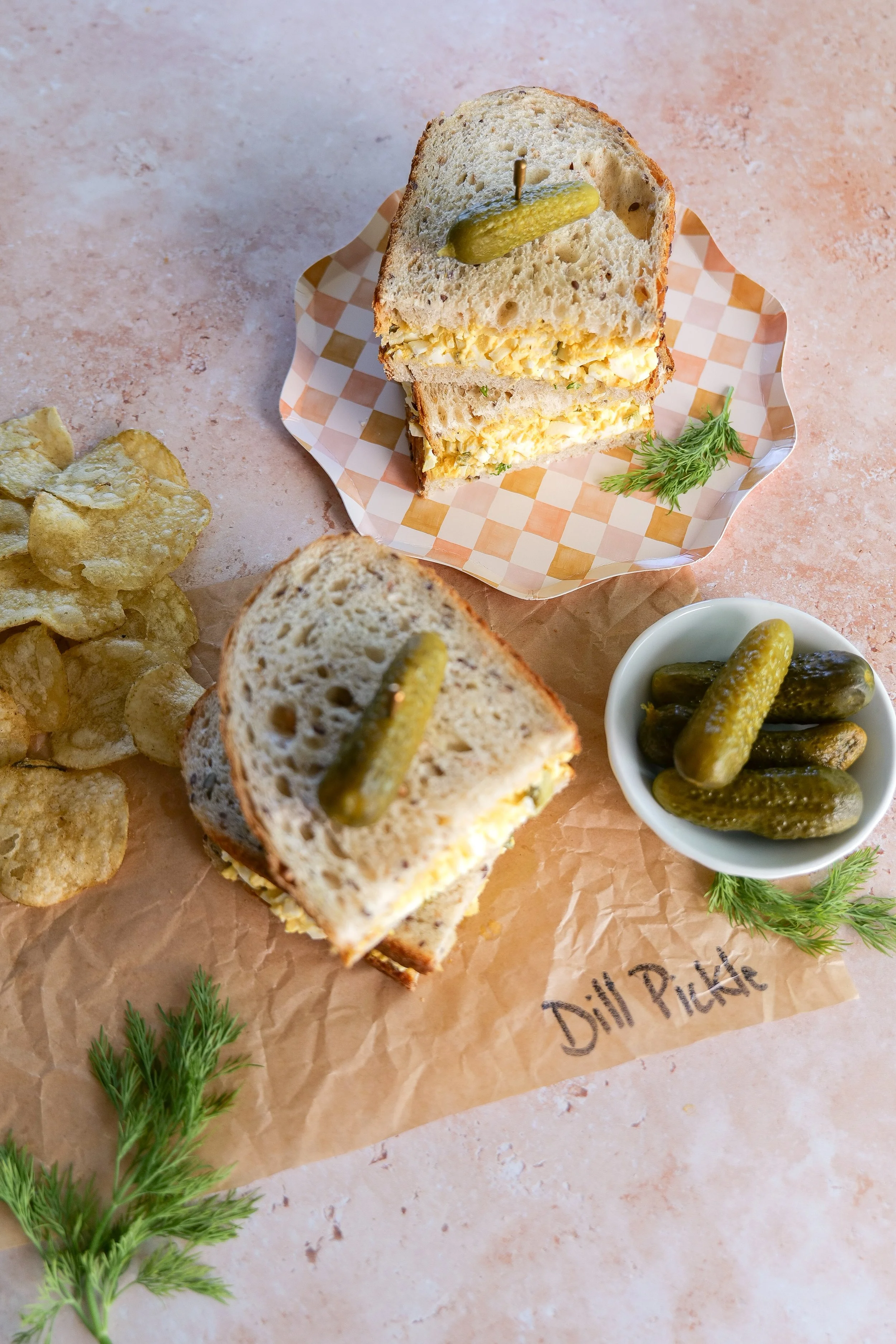 Dill pickle egg salad sandwich made with creamy egg salad, chopped dill pickles and fresh dill.  This should be your strongest finished sandwich image.