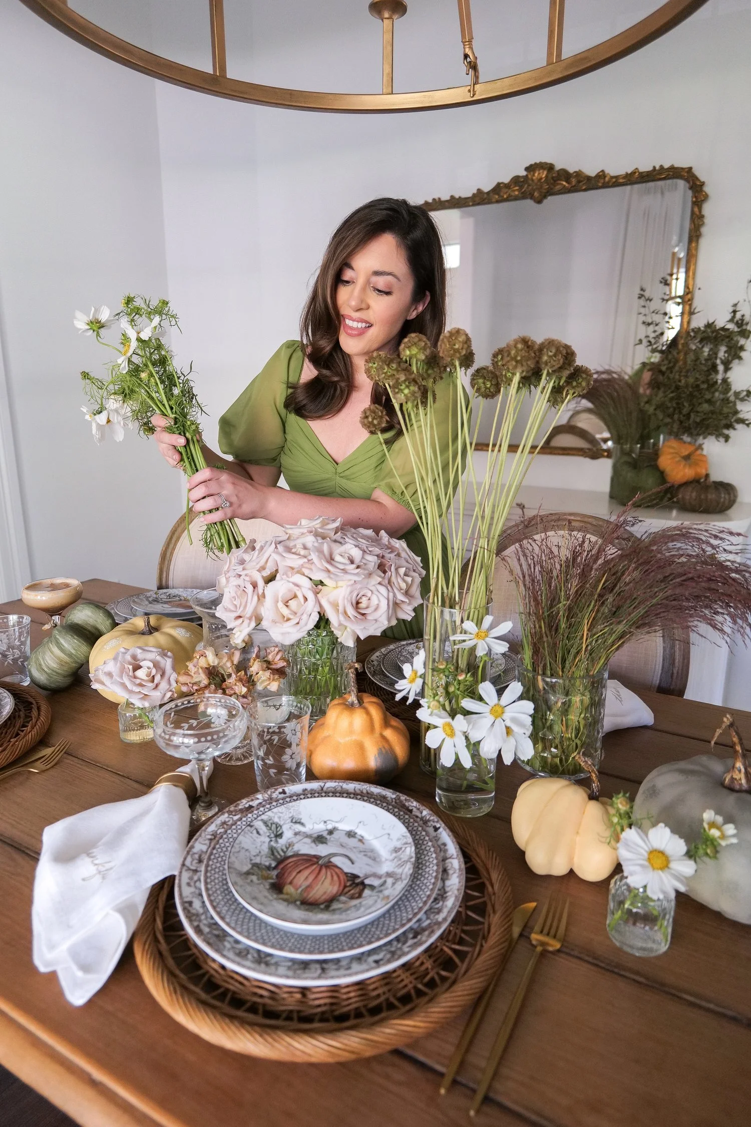 Rustic Thanksgiving table decorated with pumpkins and flowers