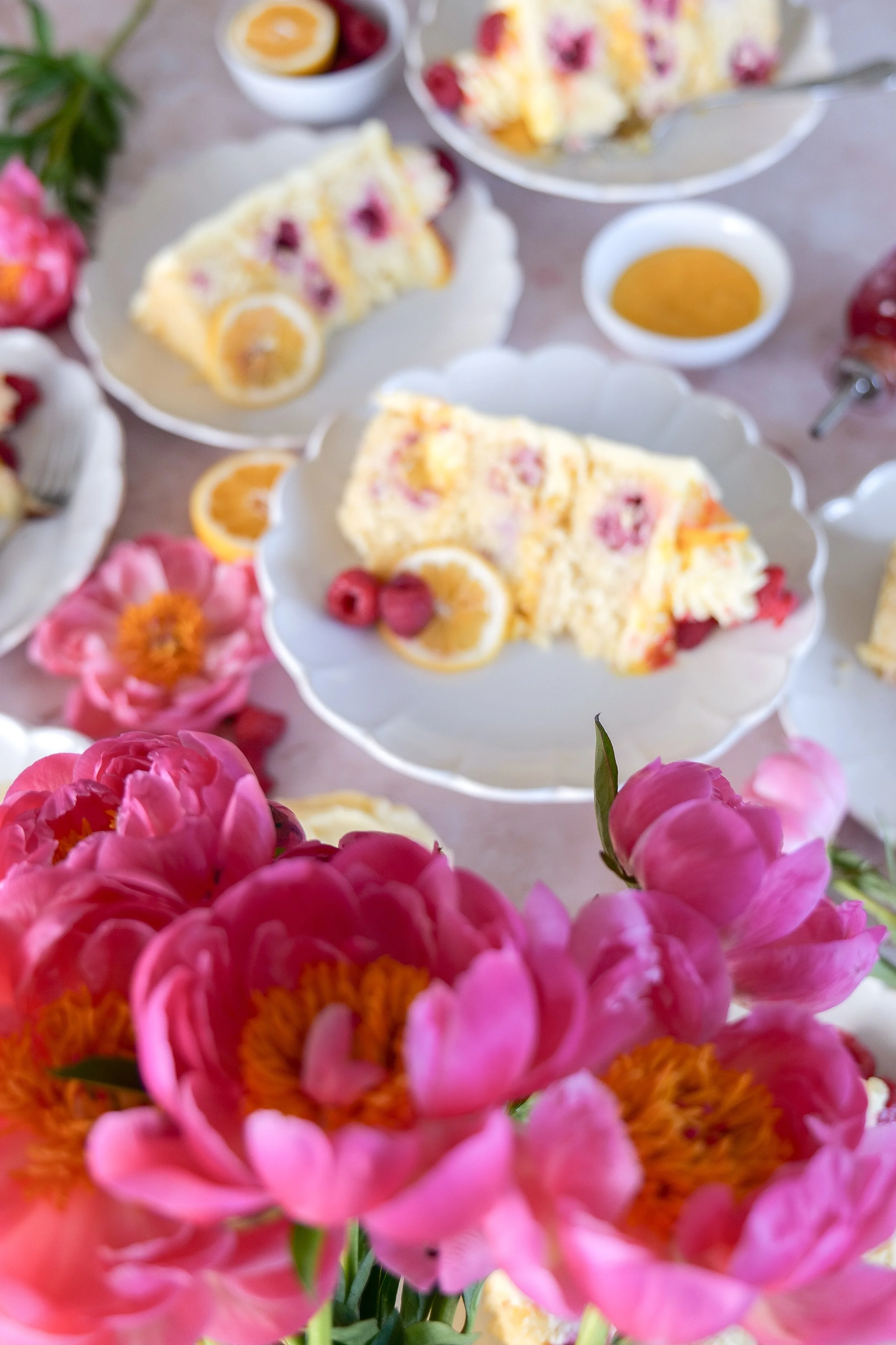 Lemon raspberry cake with smooth buttercream frosting and berries.