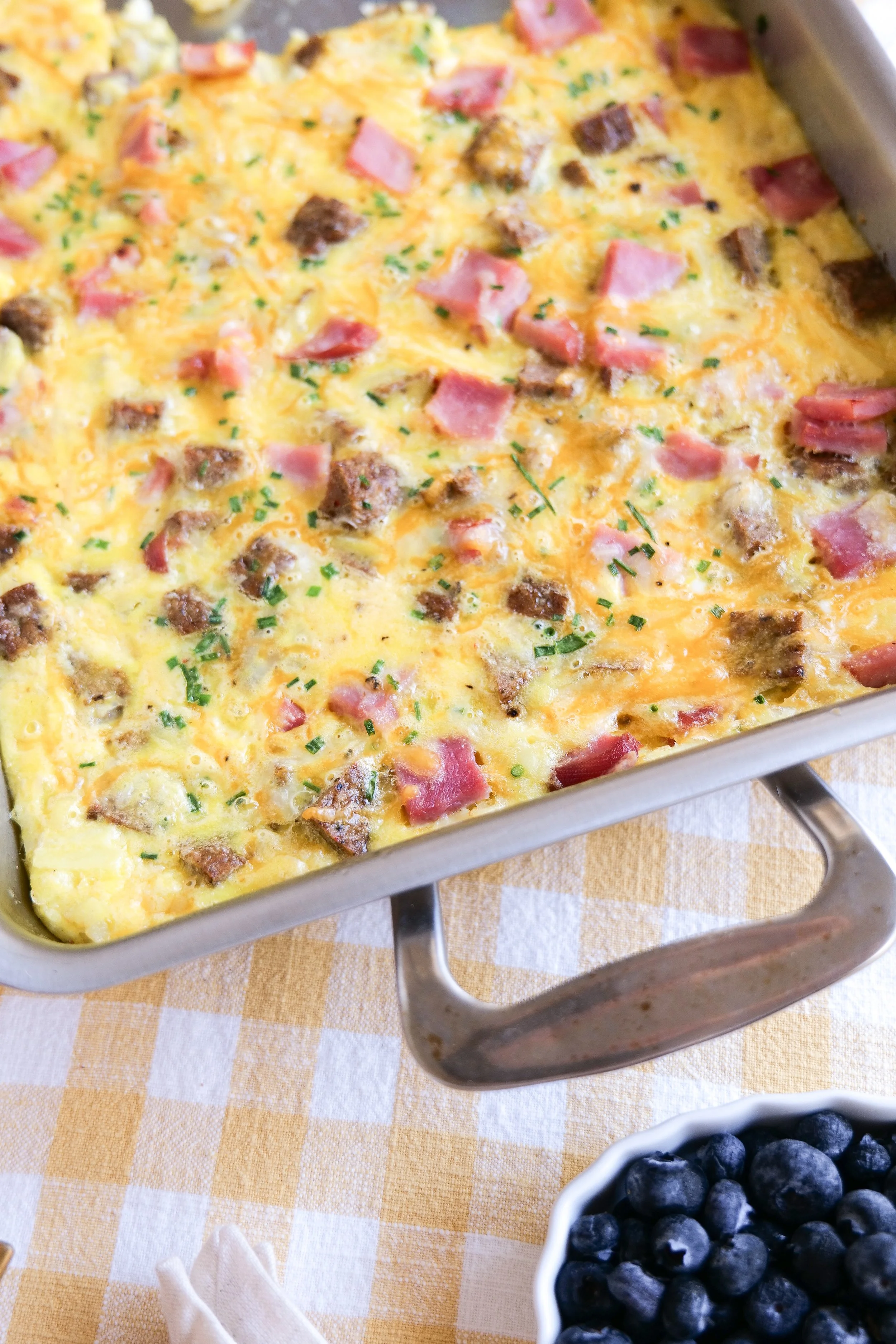 Breakfast casserole with sausage, cheese, eggs, and crispy hash browns.
