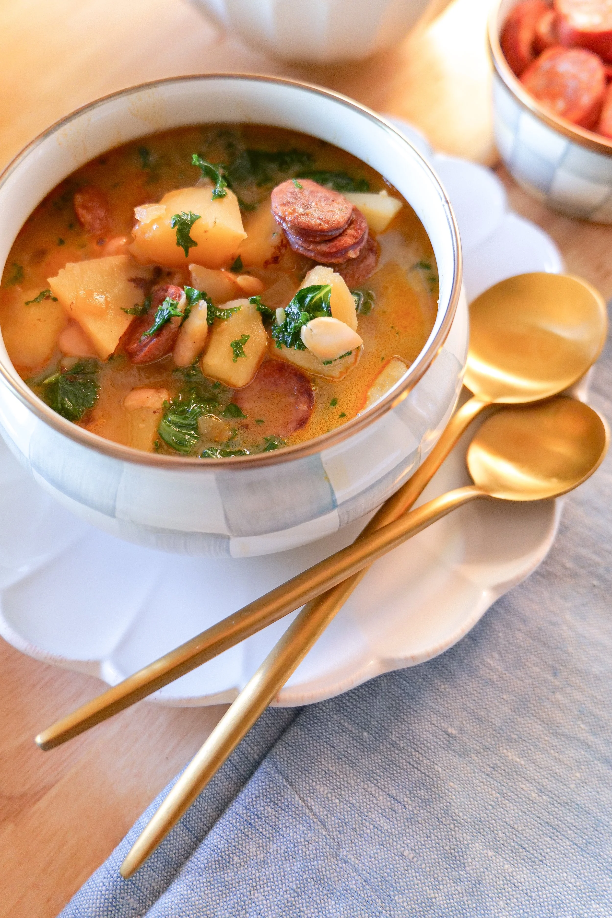 Homemade Portuguese linguiça soup filled with kale, potatoes and white beans.