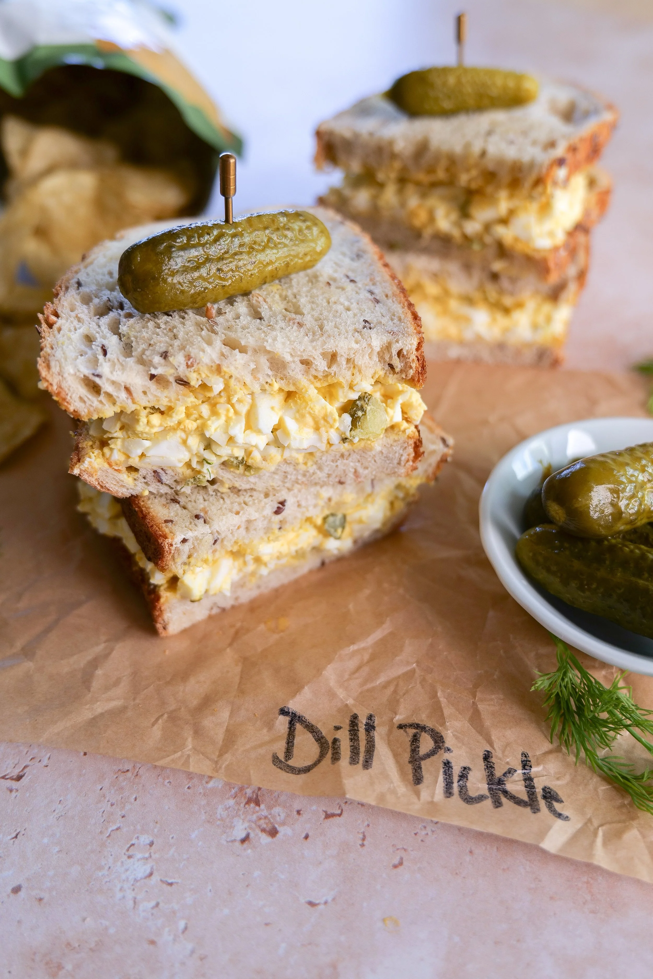 Easy dill pickle egg salad piled onto bread for a quick homemade lunch.