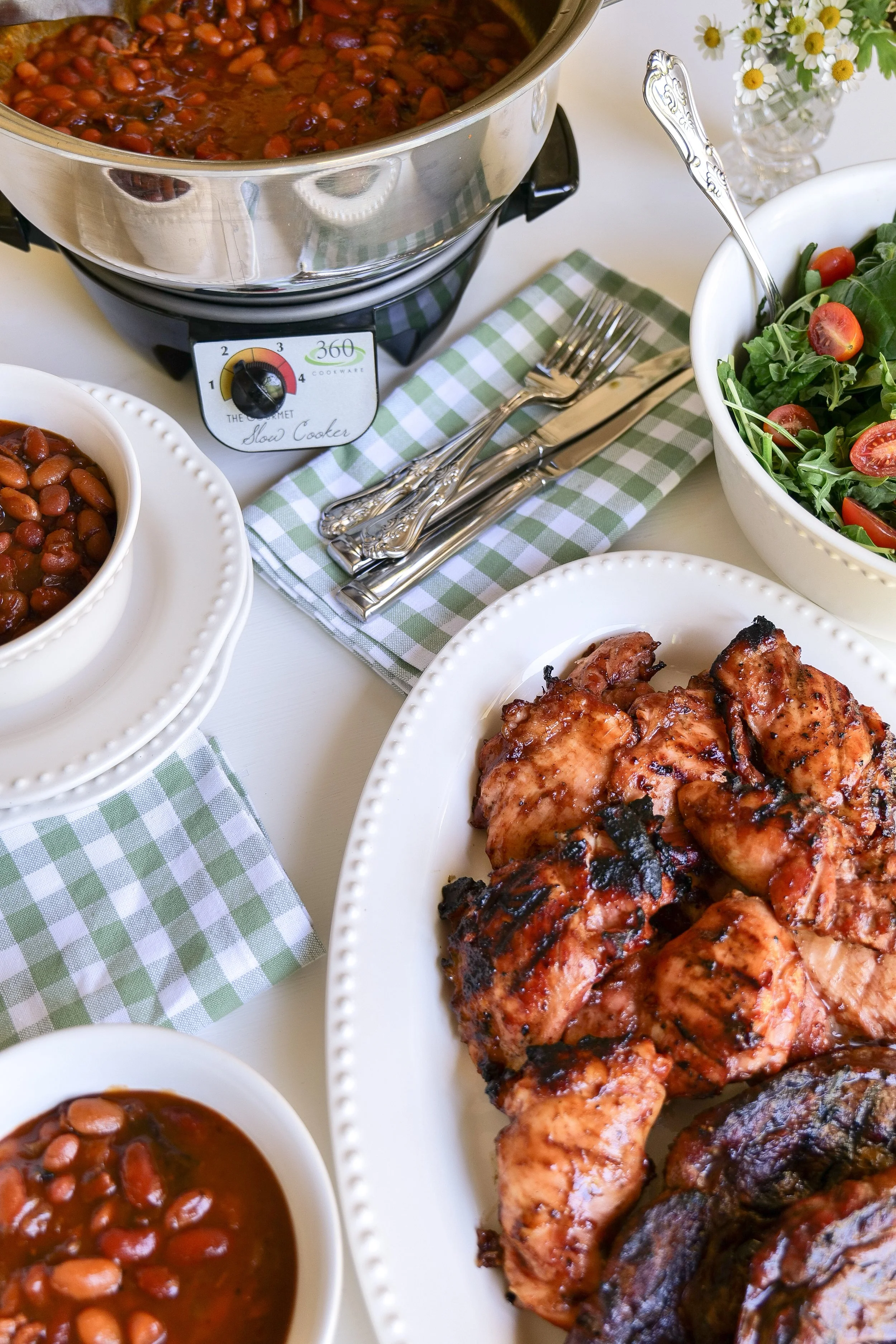 Backyard cookout baked beans made in a slow cooker with bacon