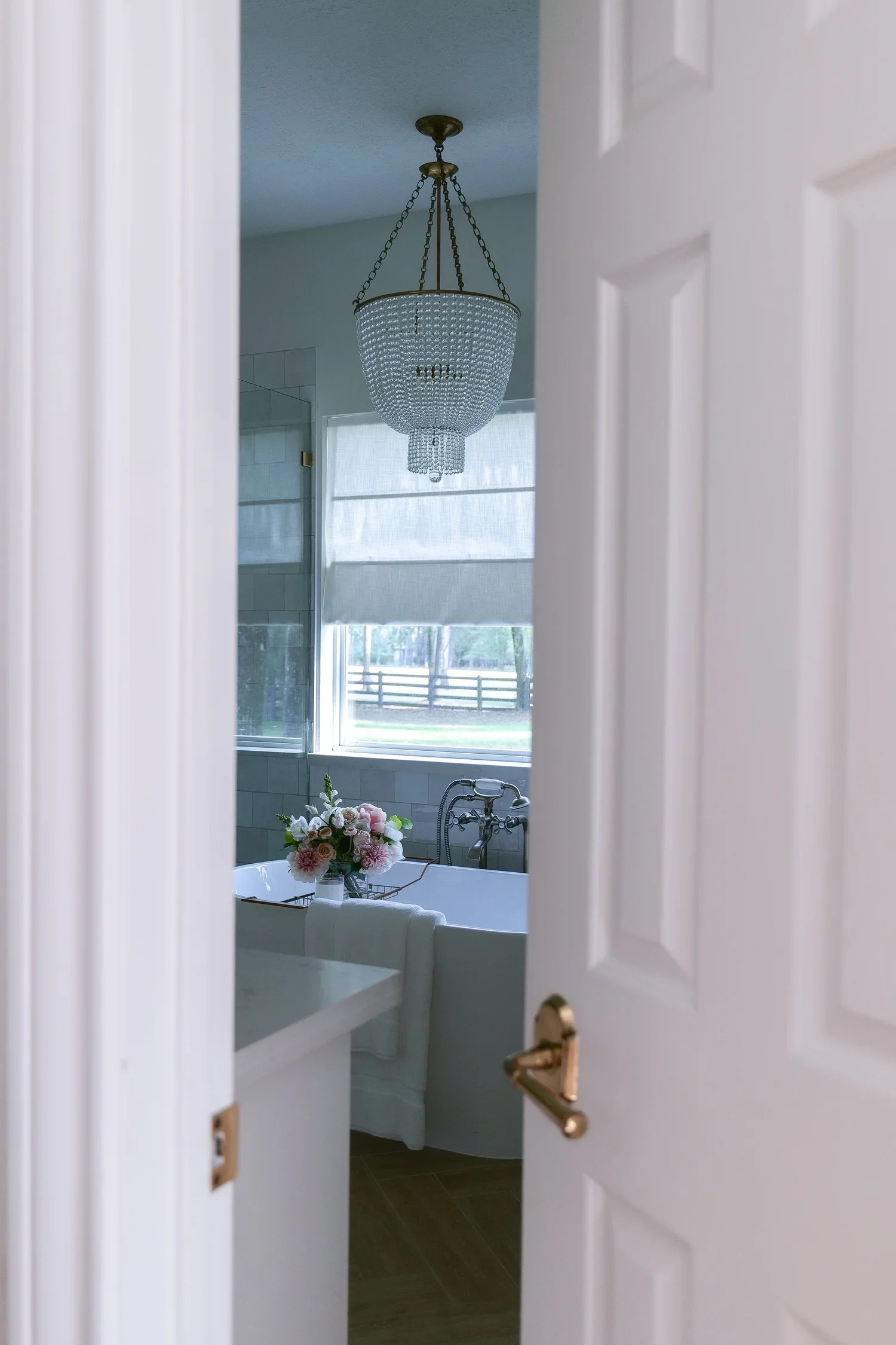 Elegant matte brass interior door knob installed in a bright traditional home during a simple home renovation.