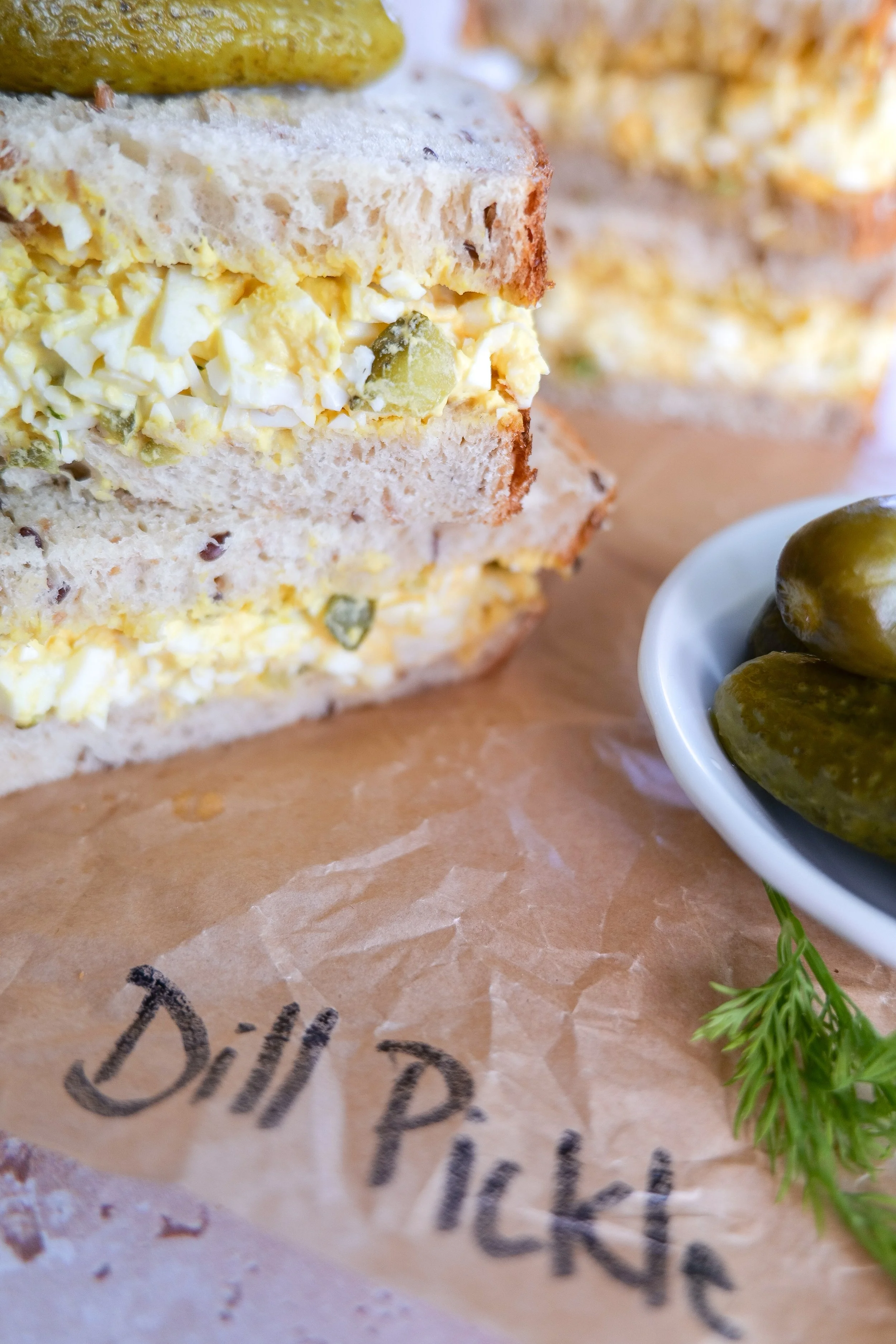 Creamy dill pickle egg salad with chopped hard-boiled eggs, pickles and fresh dill.