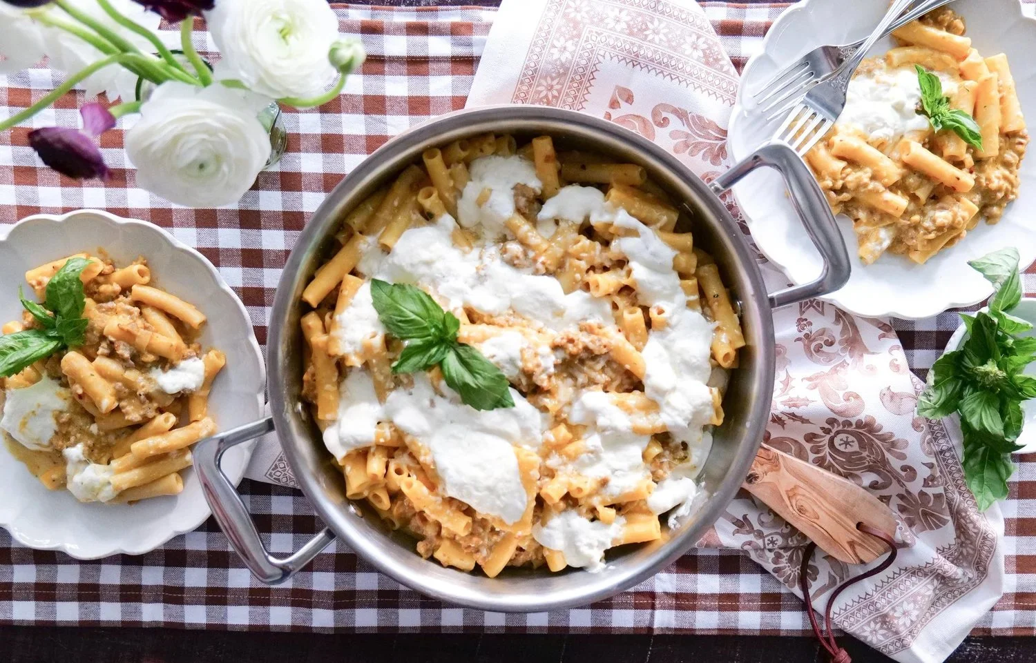 Baked pumpkin ziti with pork sausage and creamy burrata cheese.