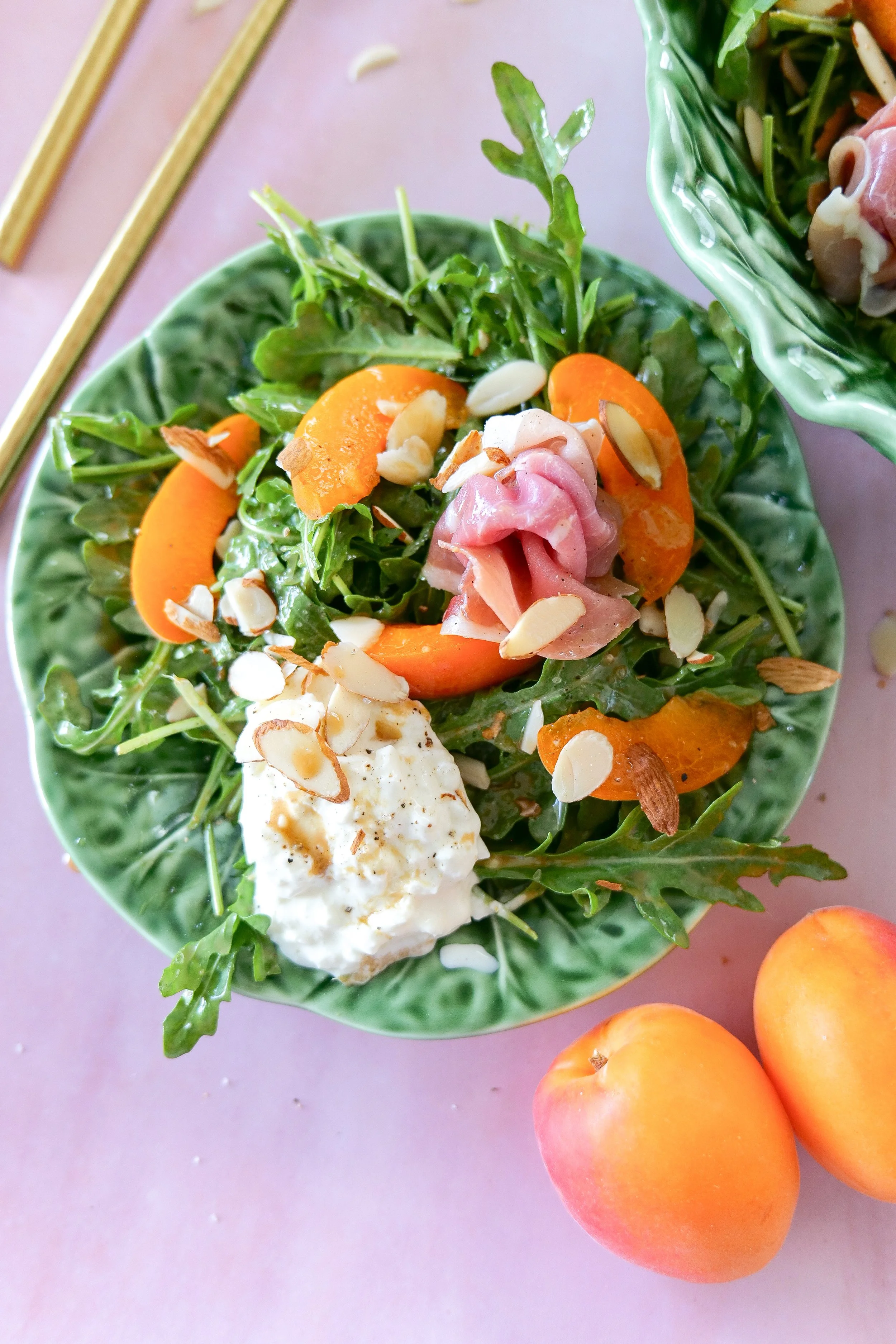 Prosciutto burrata salad with fresh apricots and toasted almonds.