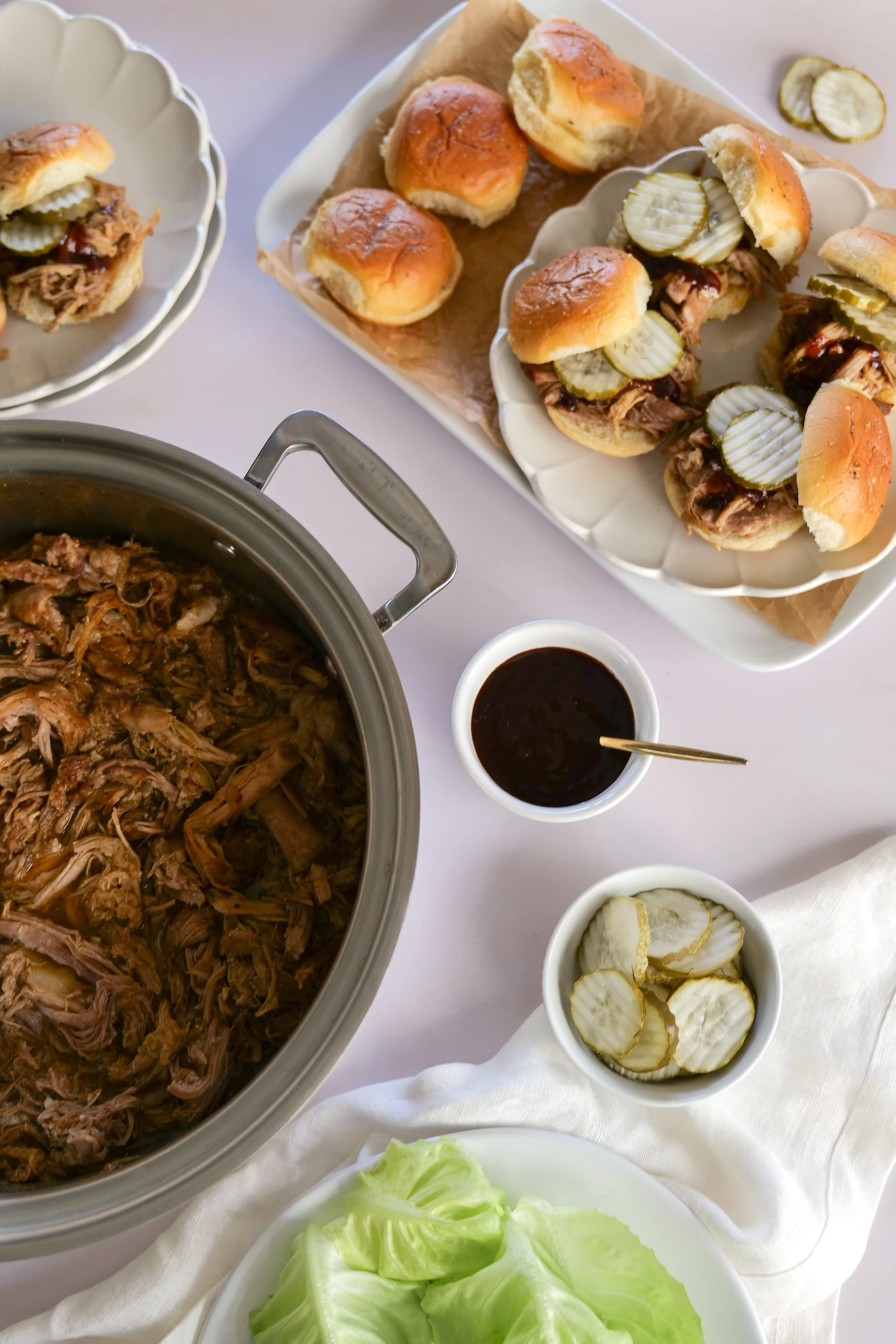 Tender homemade slow cooker pulled pork seasoned with a brown sugar and spice dry rub.