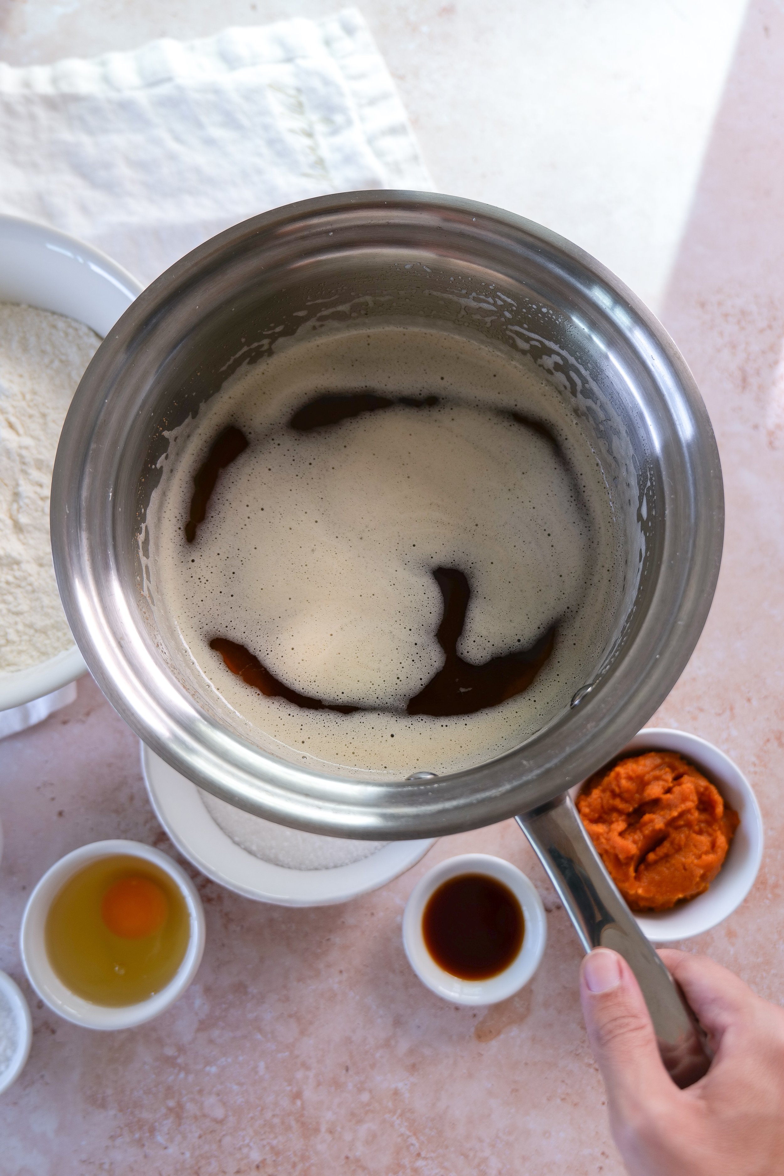 Brown butter with toasted milk solids in a saucepan for pumpkin cookies