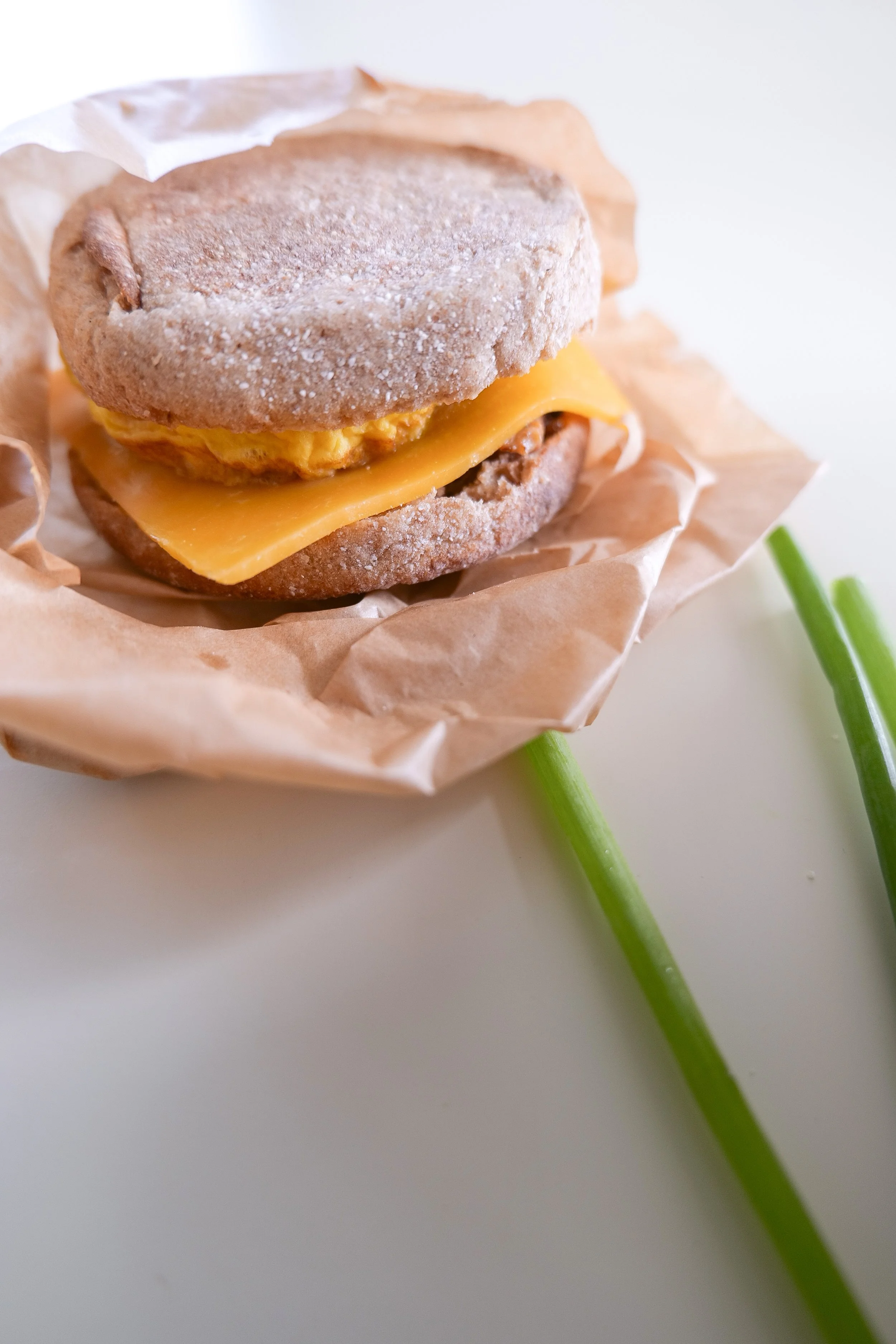 Sausage, egg and melted cheese layered inside a toasted English muffin.