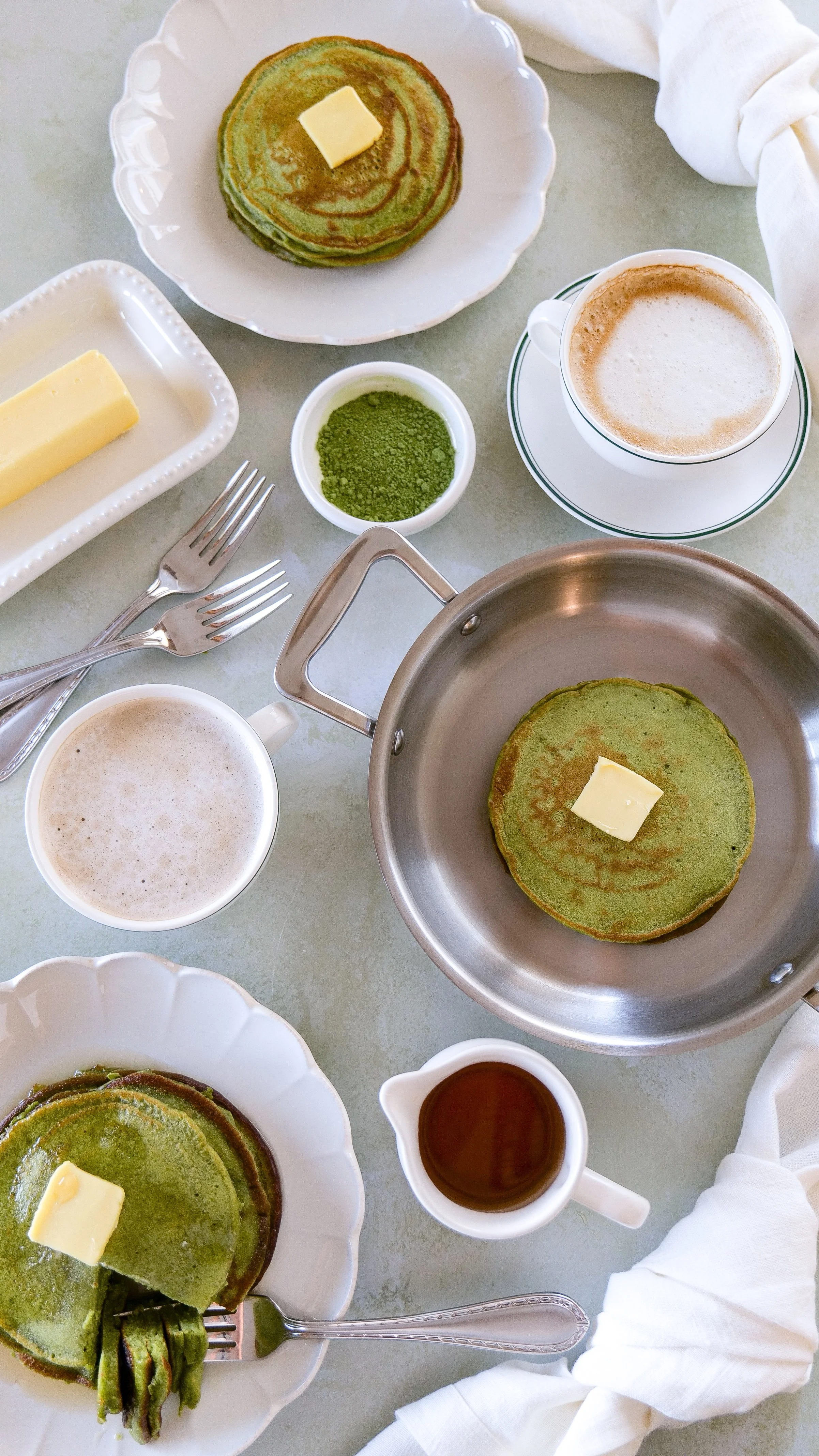 Soft and airy green pancakes on breakfast table