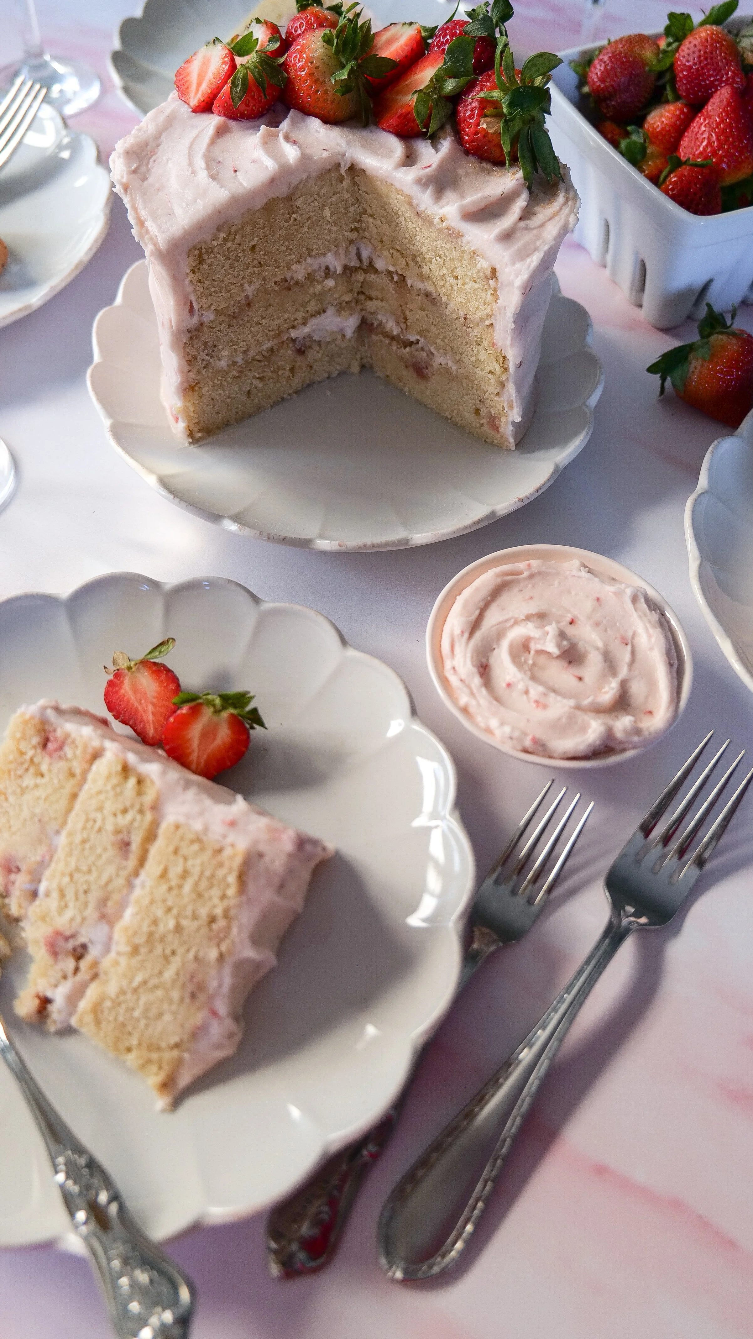 Finished Strawberry Champagne Cake made with strawberry purée and champagne.