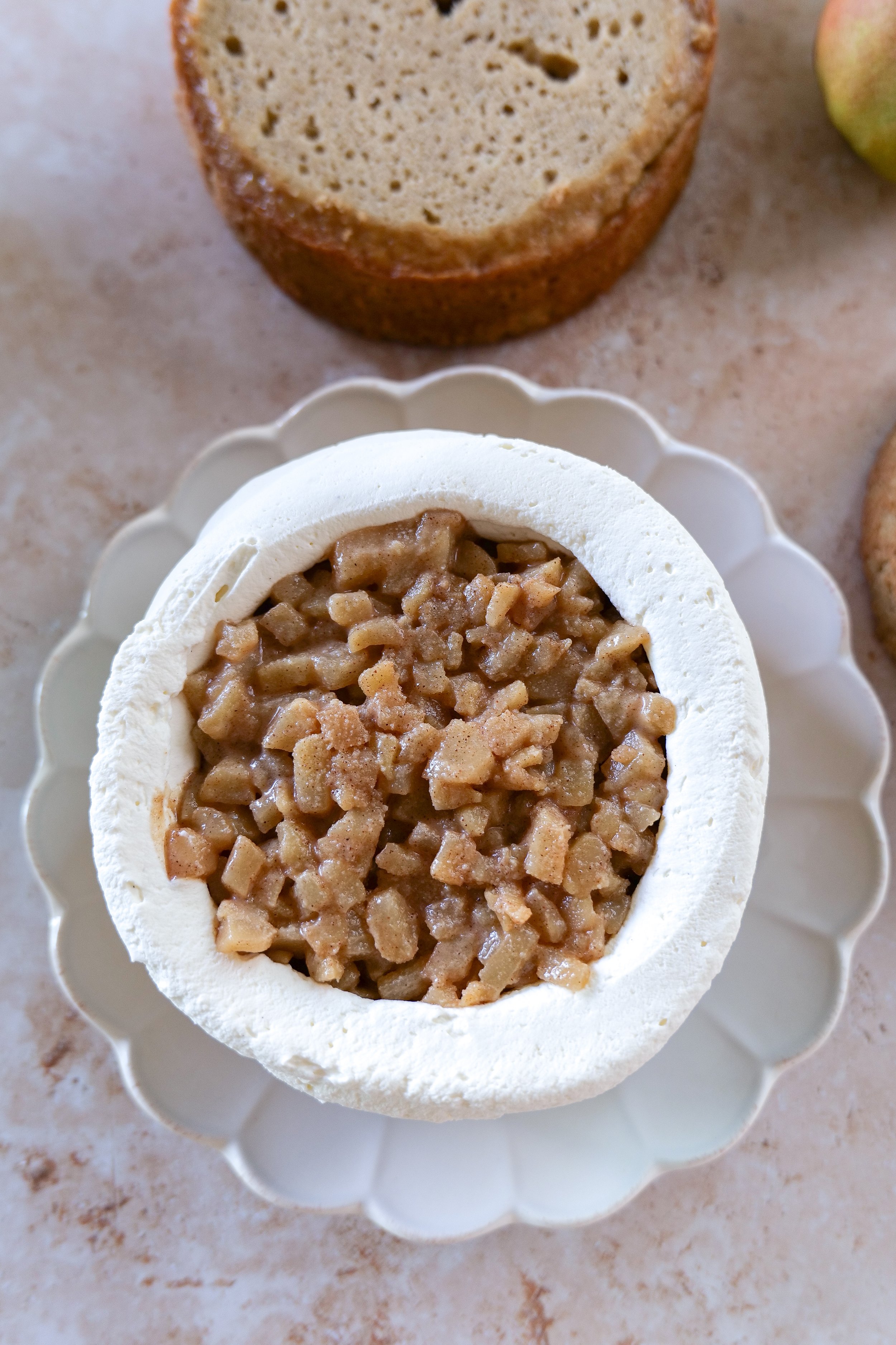 Brown butter pear cake layered with vanilla mascarpone cream and spiced pear filling.