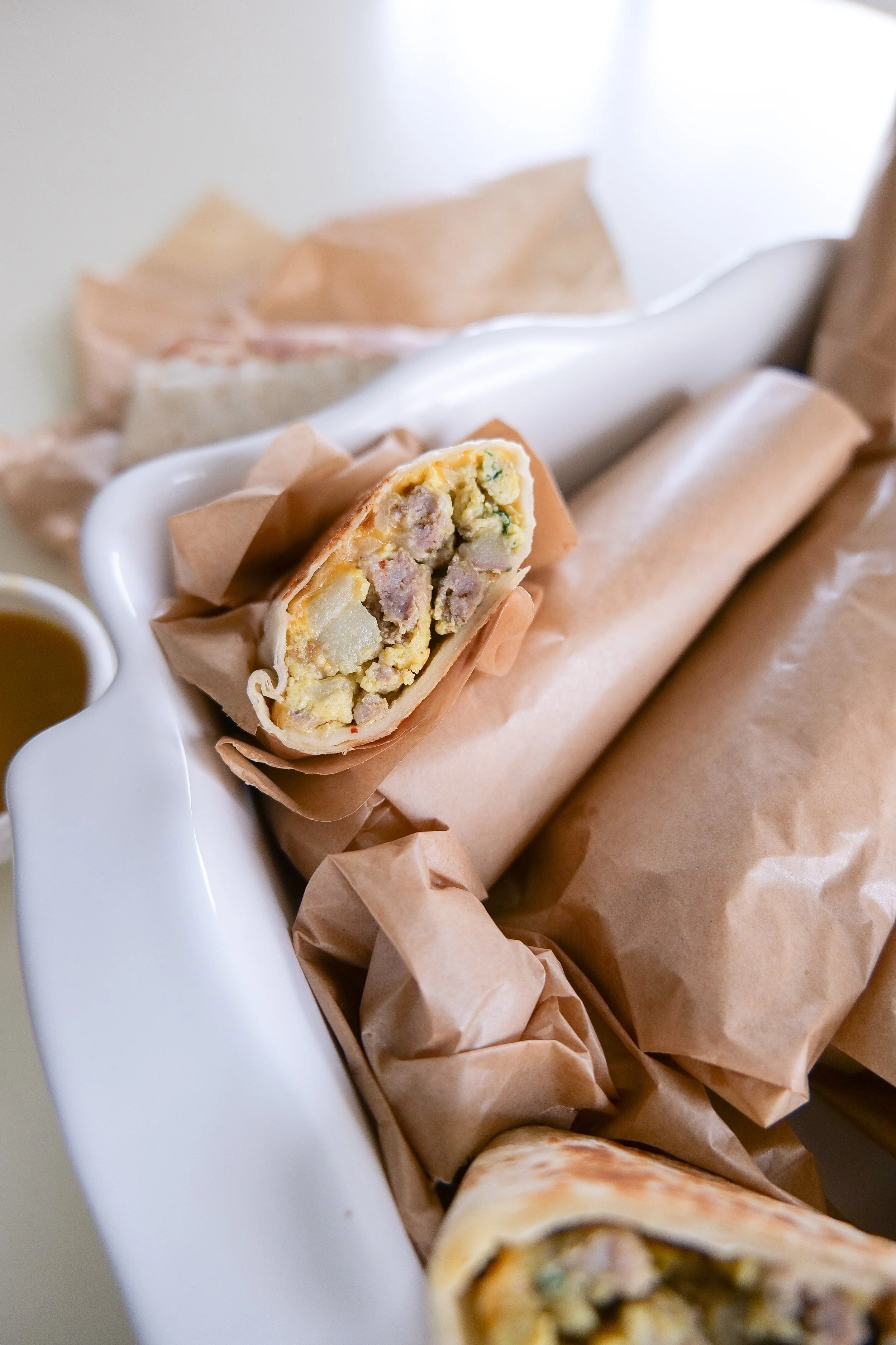 Homemade make-ahead breakfast burritos prepared for an easy family breakfast on busy mornings.