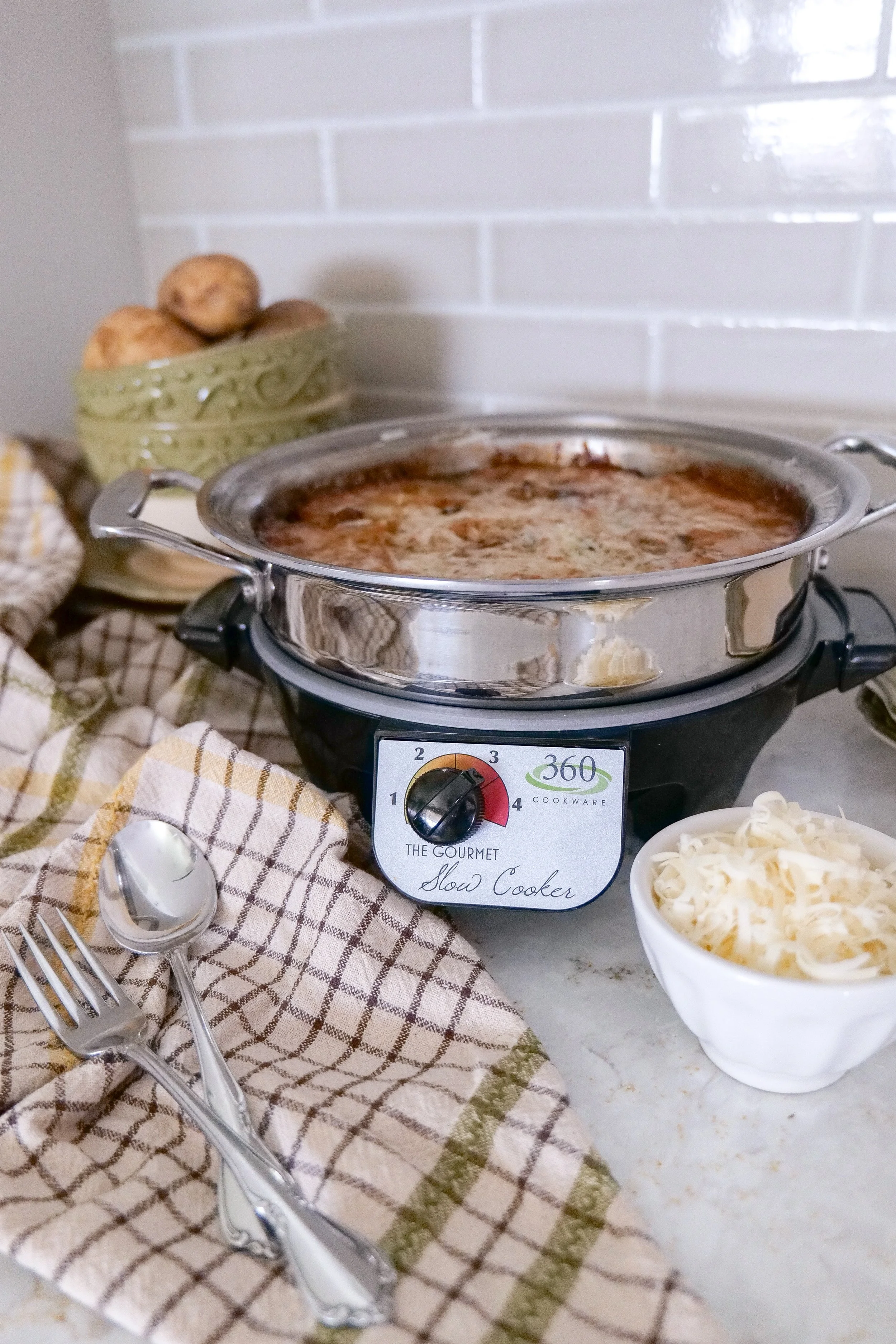 Close-up of creamy slow cooker scalloped potatoes ready to serve.