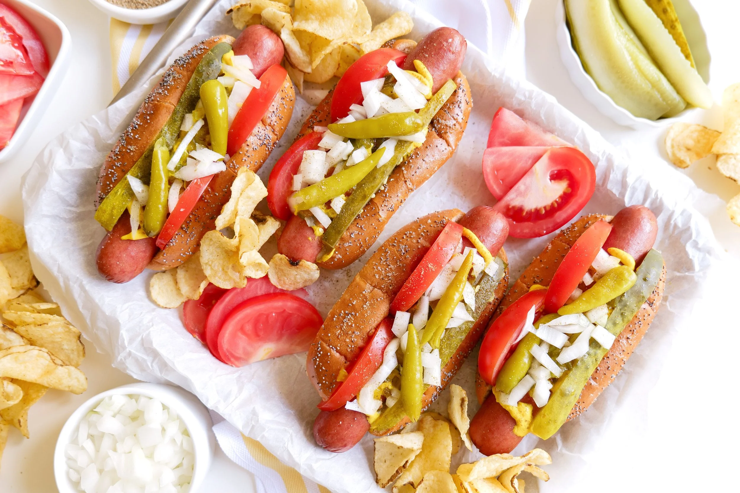 Backyard barbecue spread featuring authentic Chicago style hot dogs.