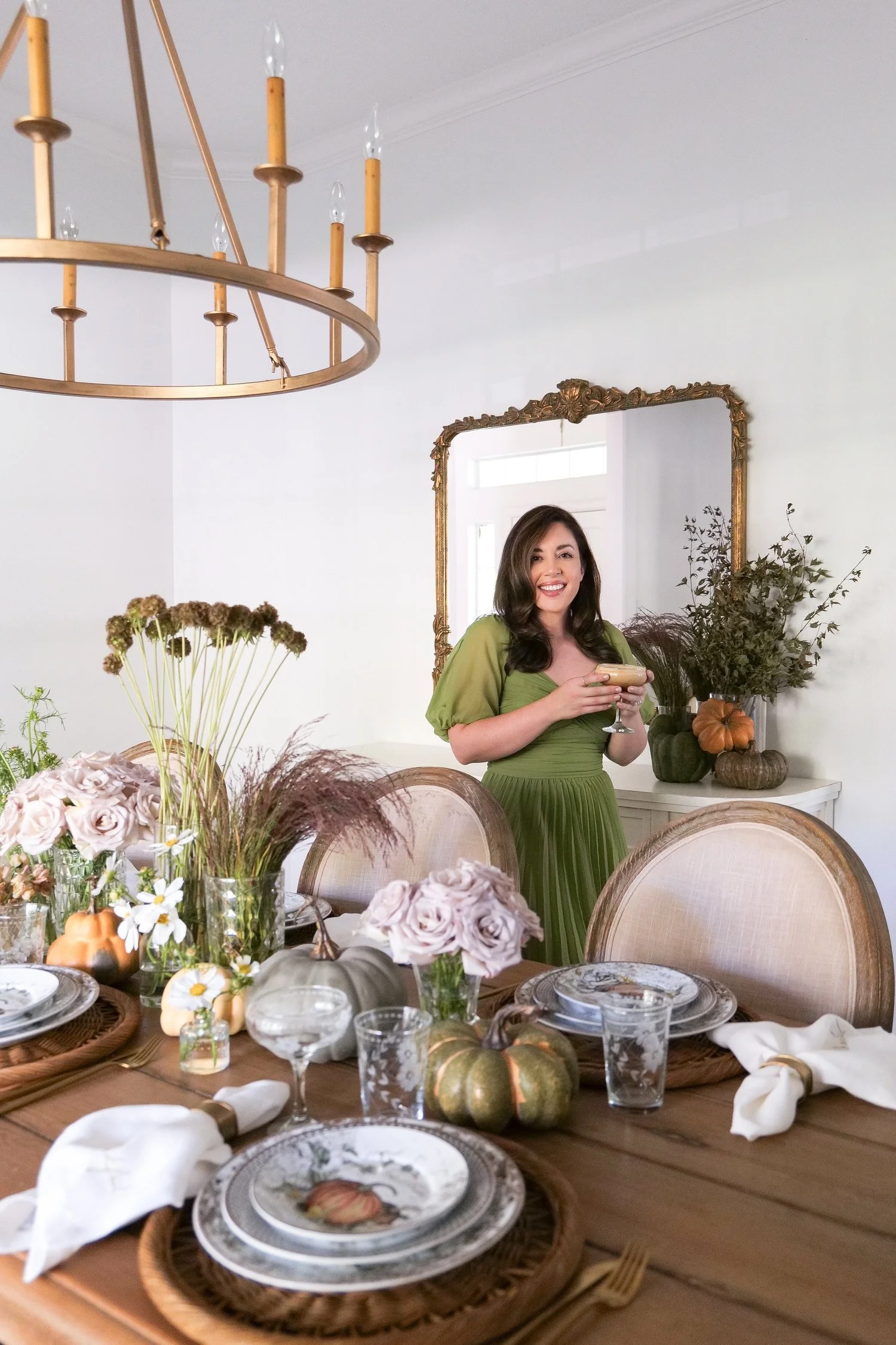 Thanksgiving tablescape with pumpkins and rustic flowers