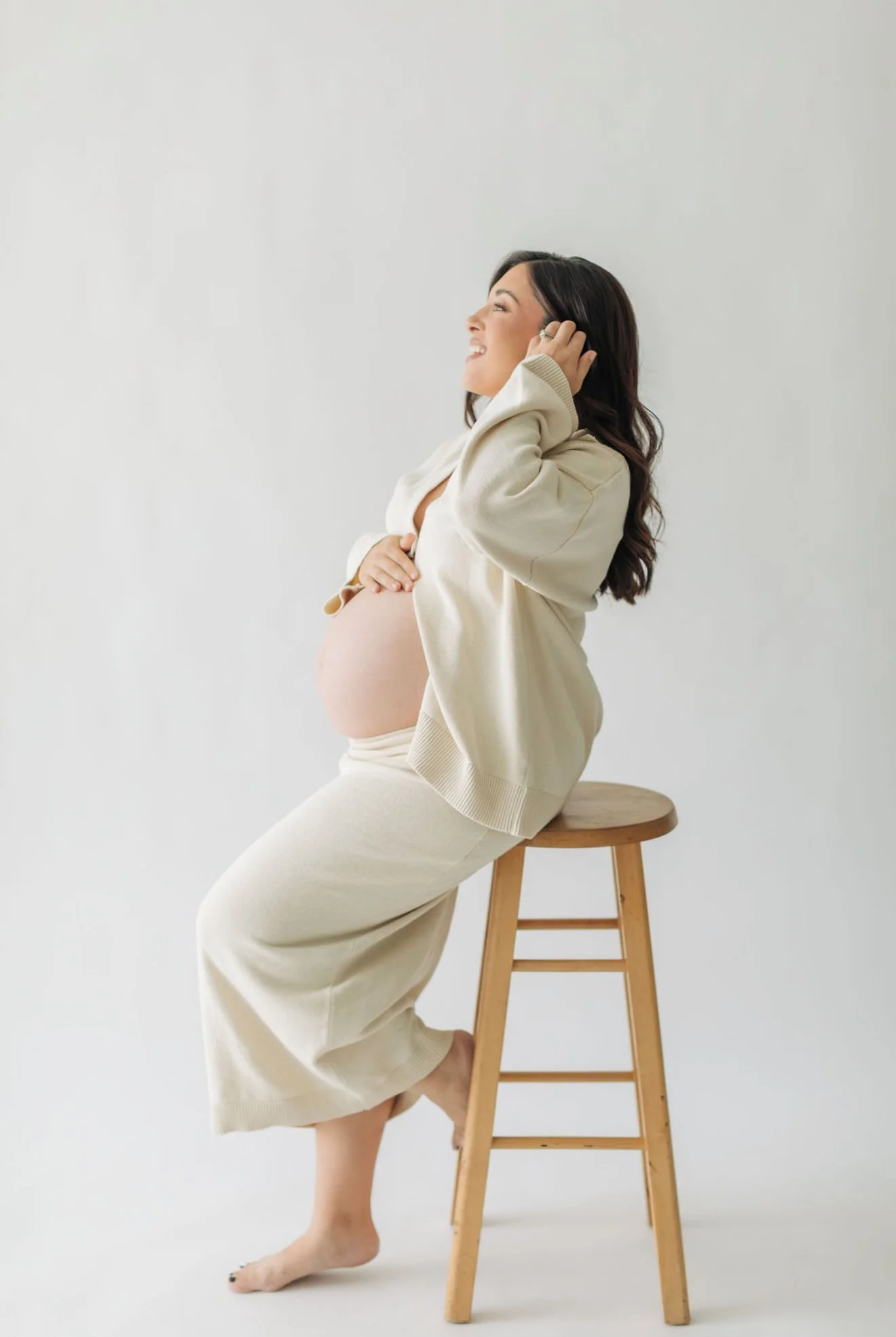 Amanda pregnant while preparing for baby and planning postpartum freezer meals.
