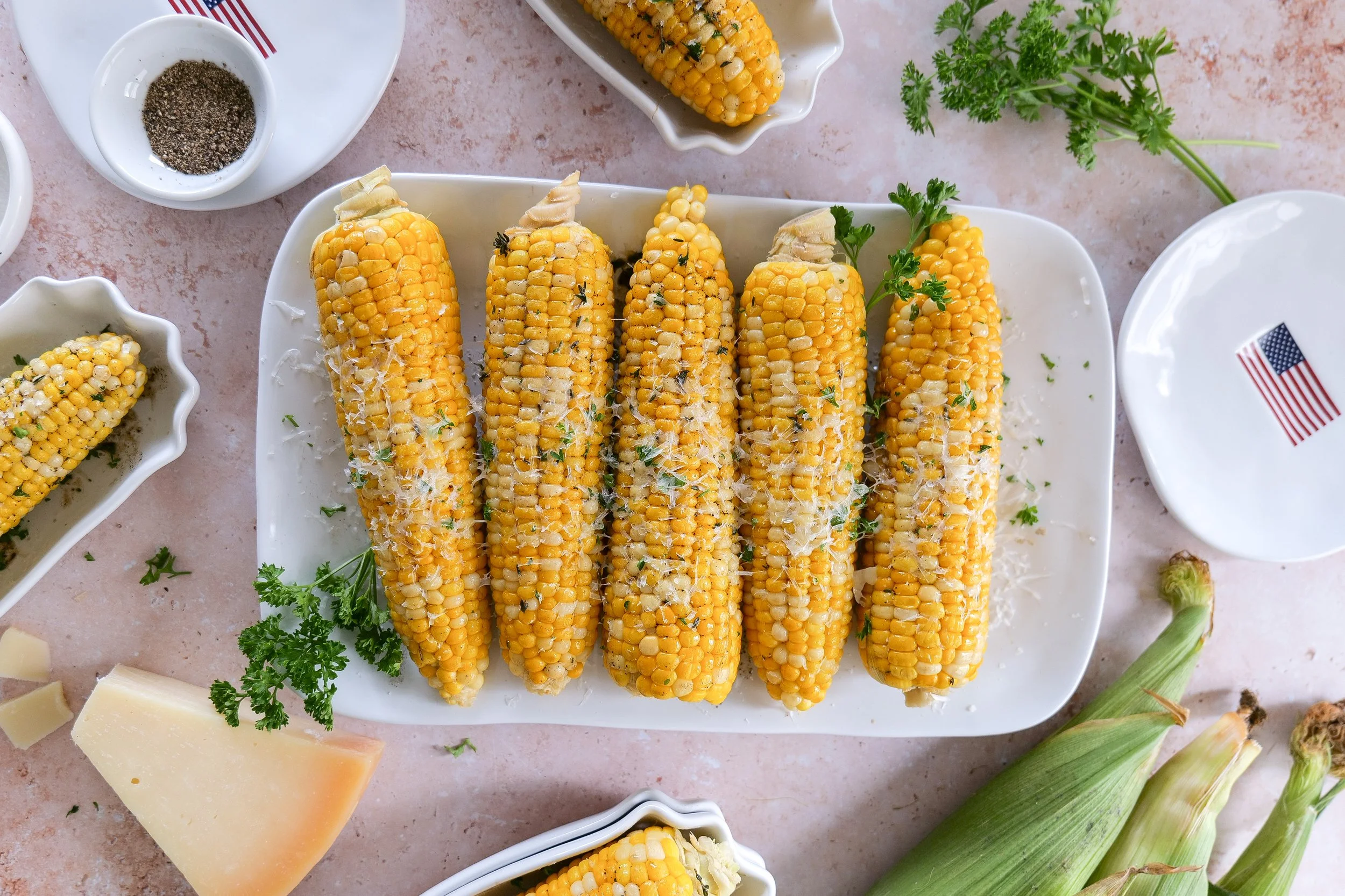 Americana summer tablescape featuring brown butter corn on the cob
