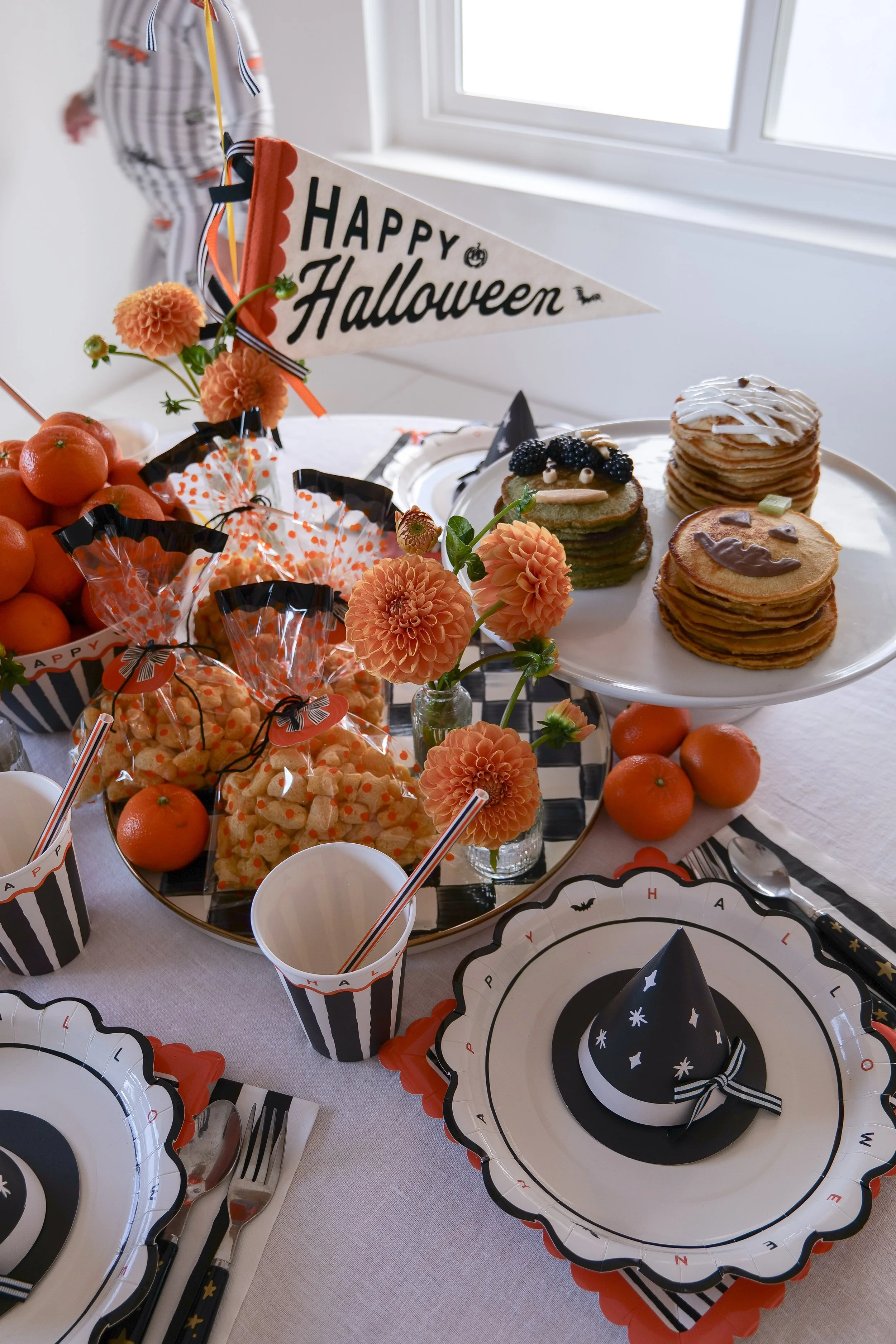 Simple Halloween tablescape for kids with festive breakfast and seasonal decorations.