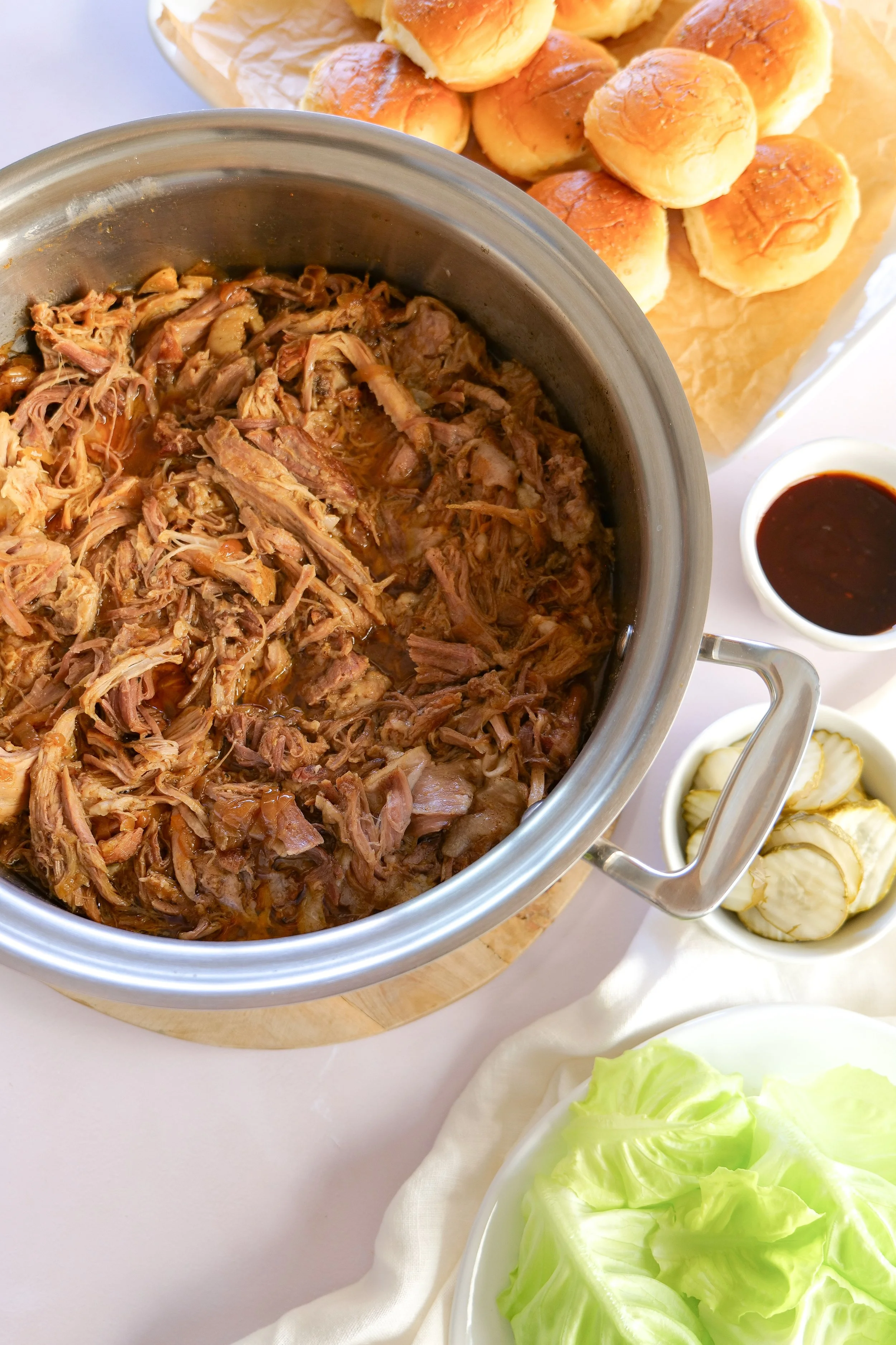 Juicy shredded slow cooker pulled pork made with pork shoulder and simple seasonings.