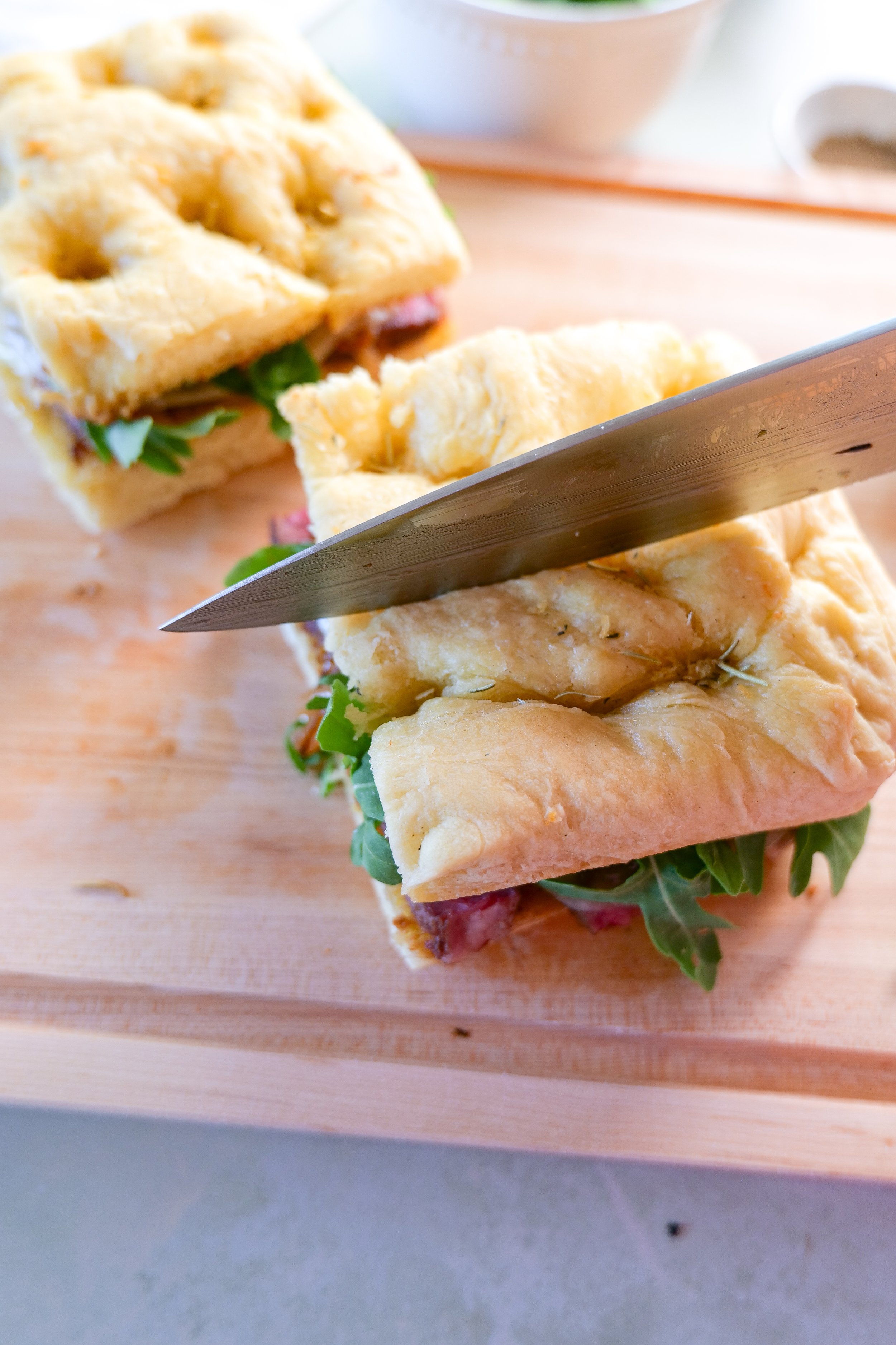 Buttery ribeye steak sandwich served on golden toasted focaccia