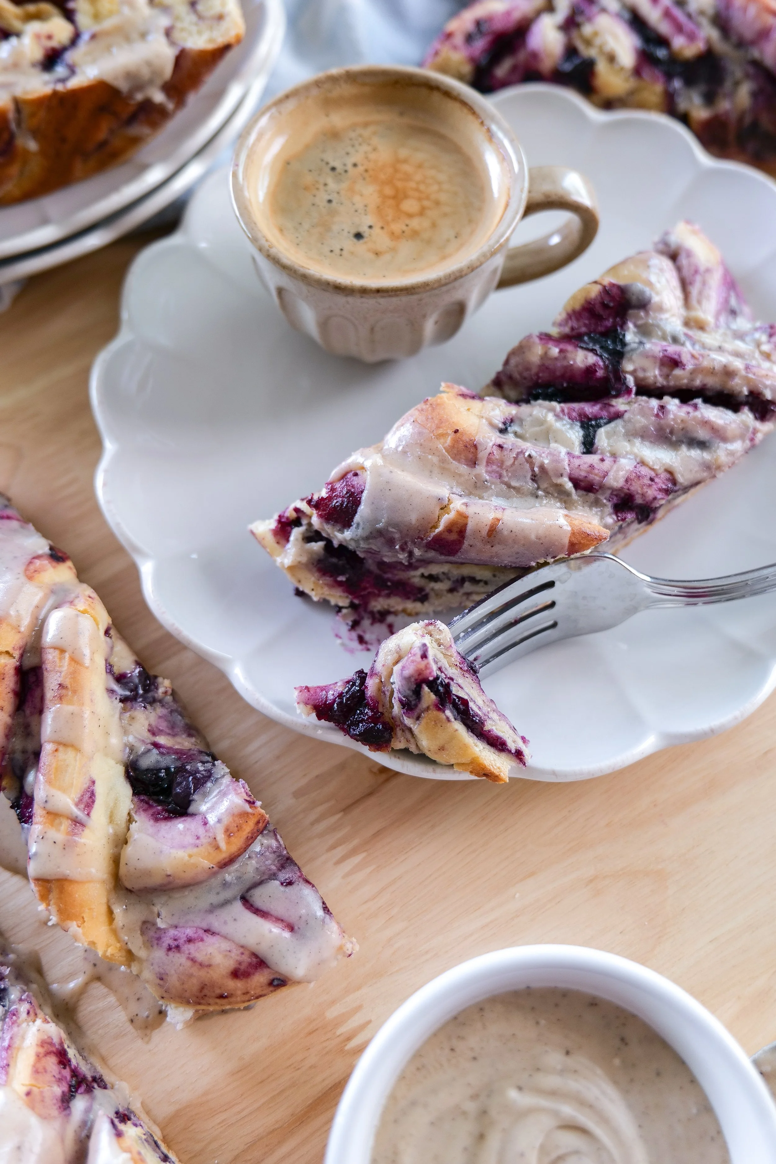 Homemade blueberry sweet bread twisted with cinnamon blueberry filling and finished with brown butter icing.
