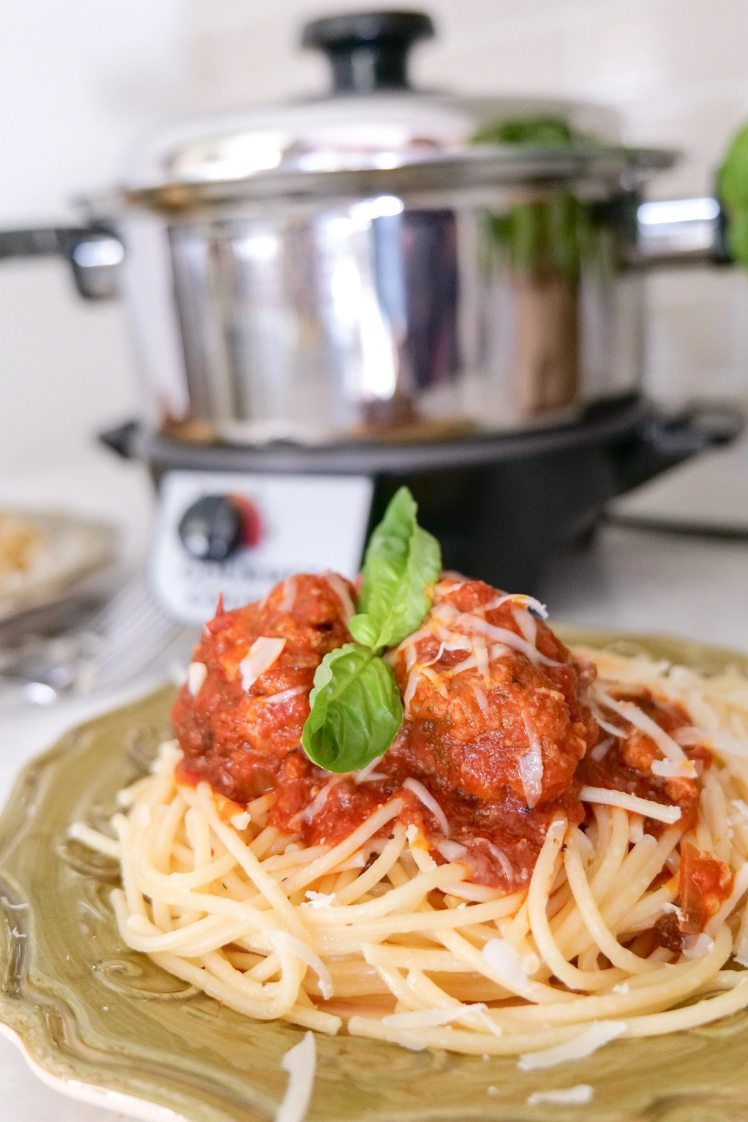 Italian meatballs garnished with fresh parsley in marinara sauce