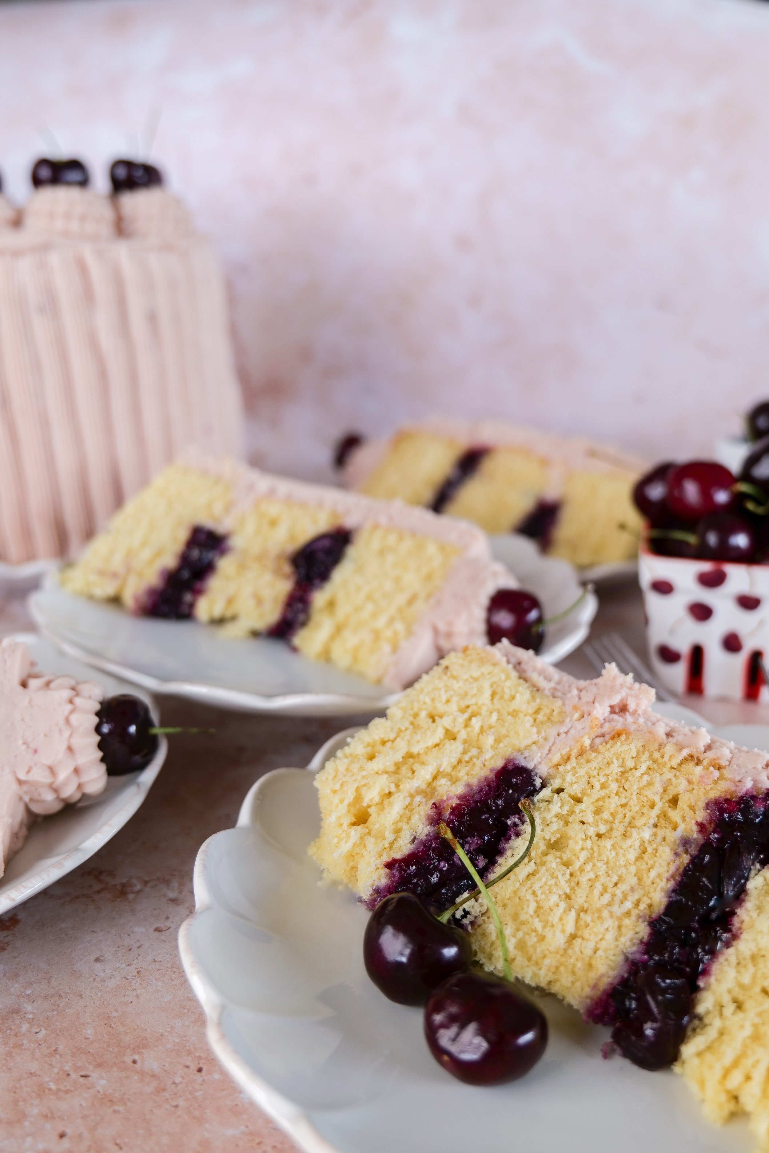 Three-layer vanilla bean cake filled with fresh cherries and finished with cherry frosting.