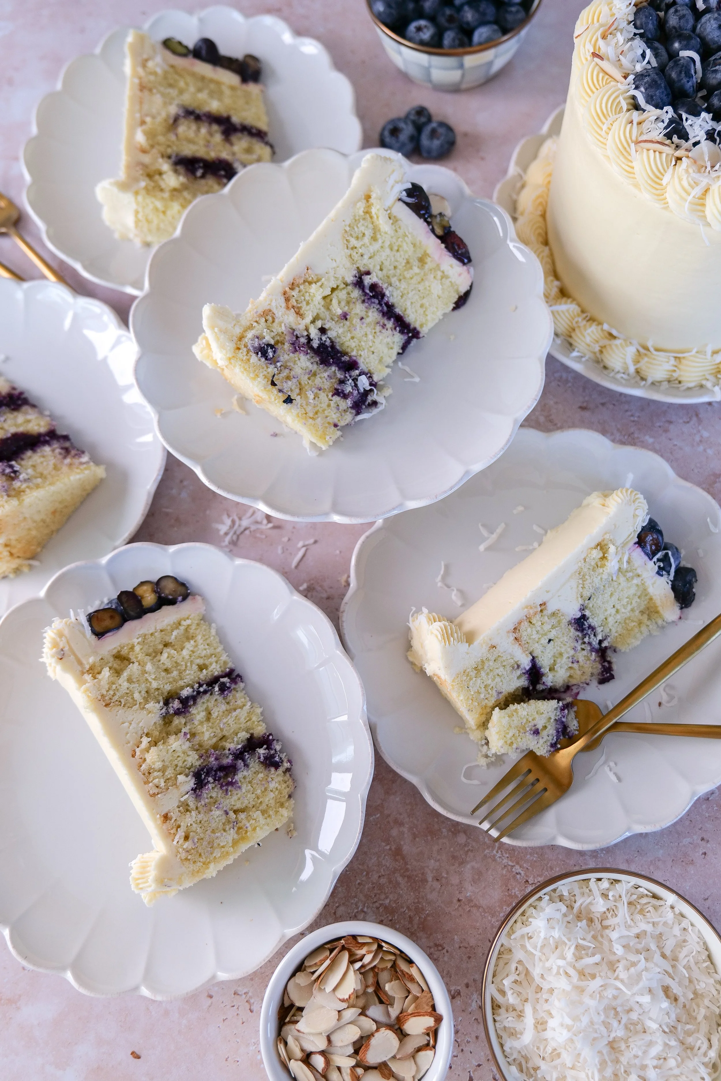 Spreading blueberry curd filling between cake layers.