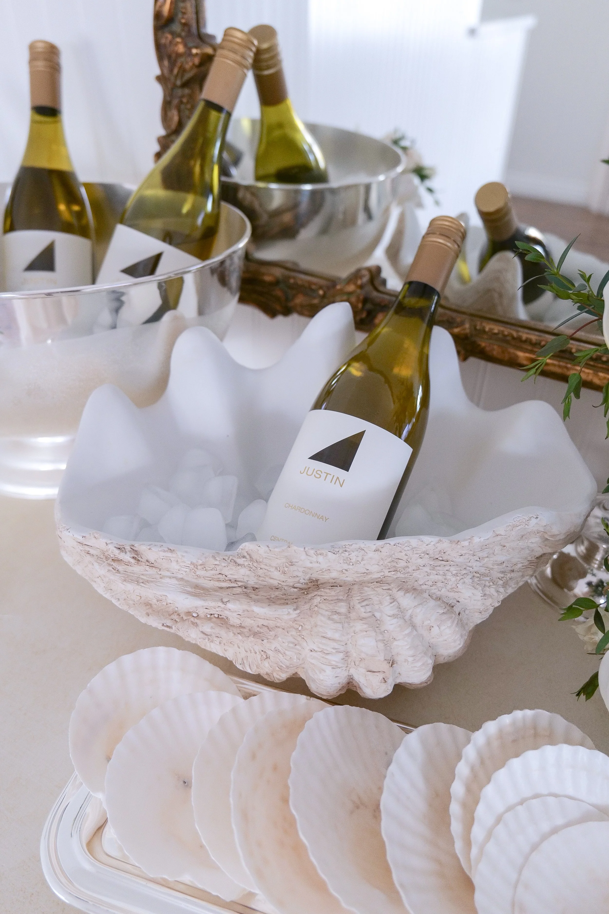 Coastal wine party setup with charcuterie and summer decor