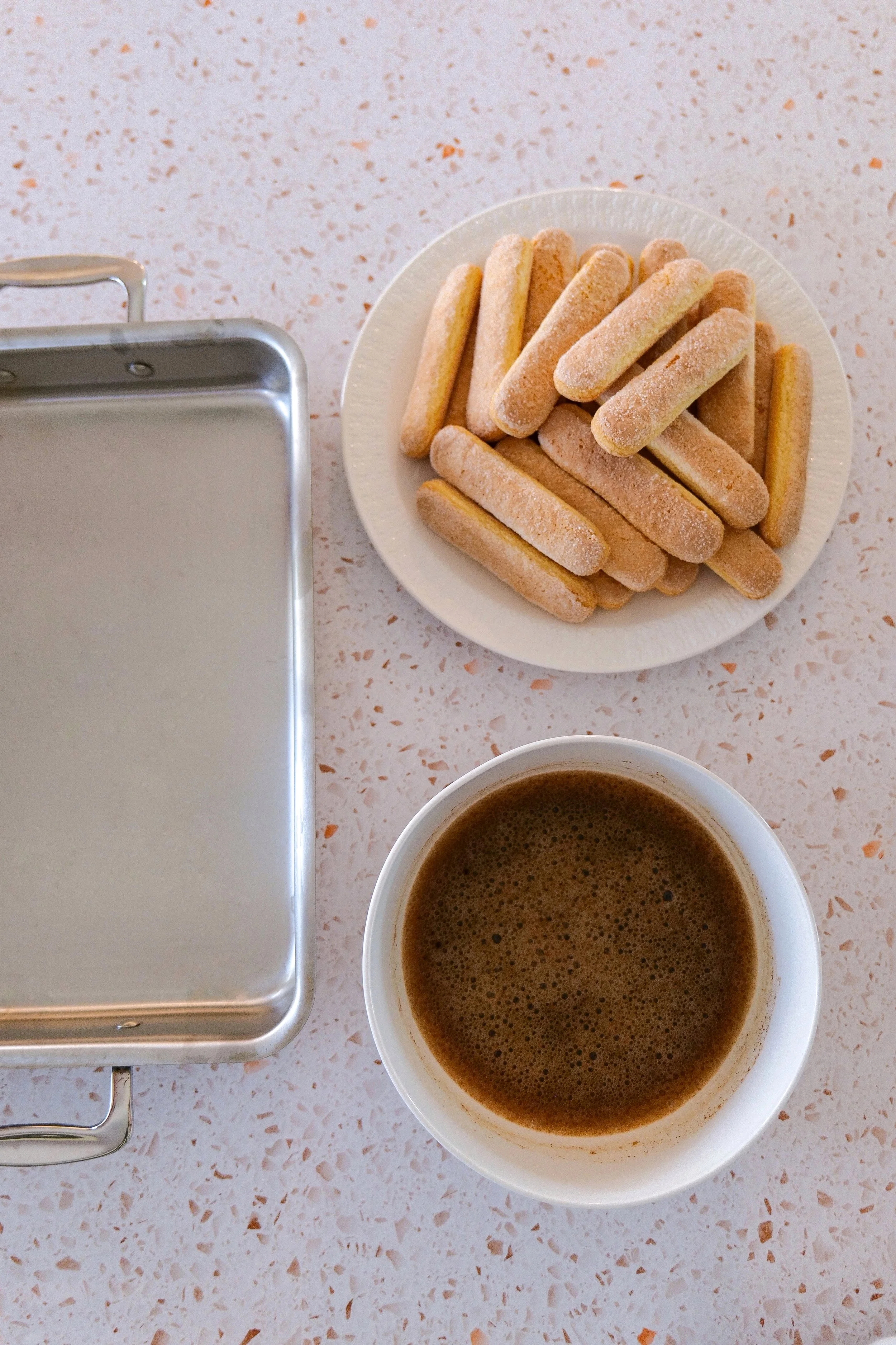 Pumpkin tiramisu ingredients arranged for making the pumpkin mascarpone filling and espresso-soaked ladyfingers.