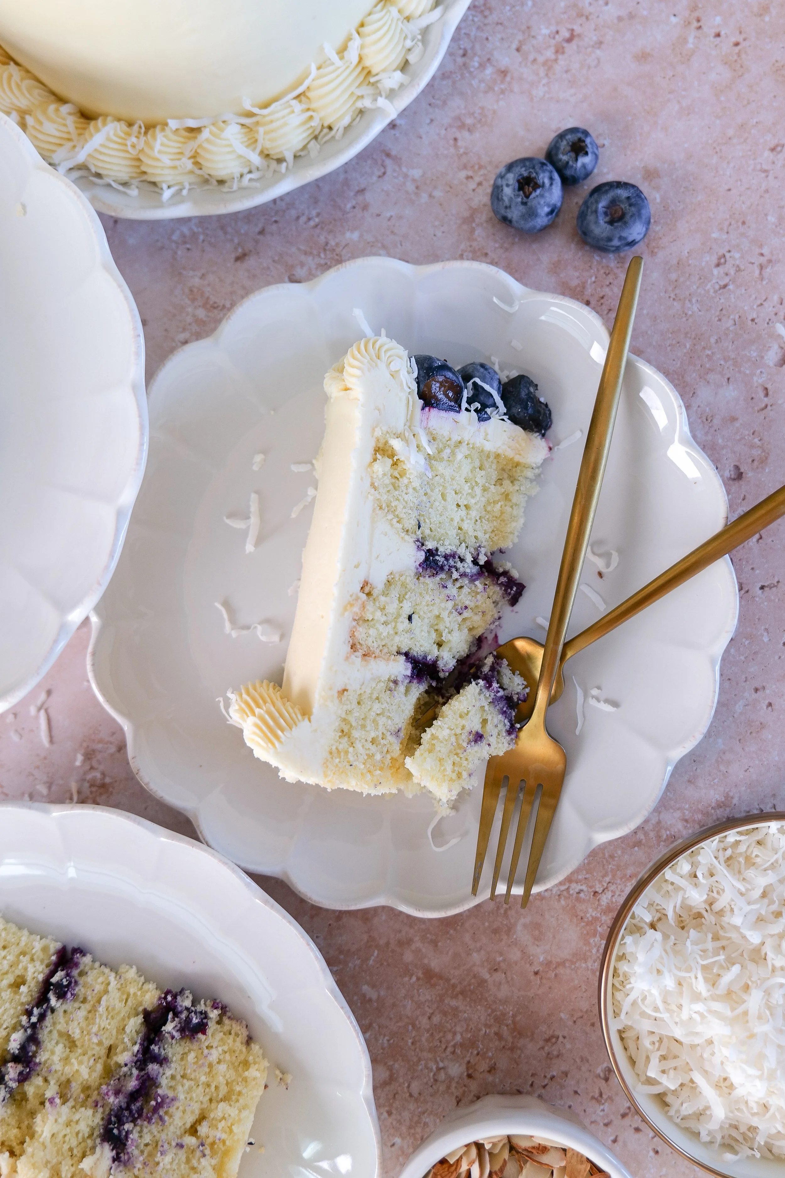 Moist almond coconut cake with a soft crumb and blueberry filling.