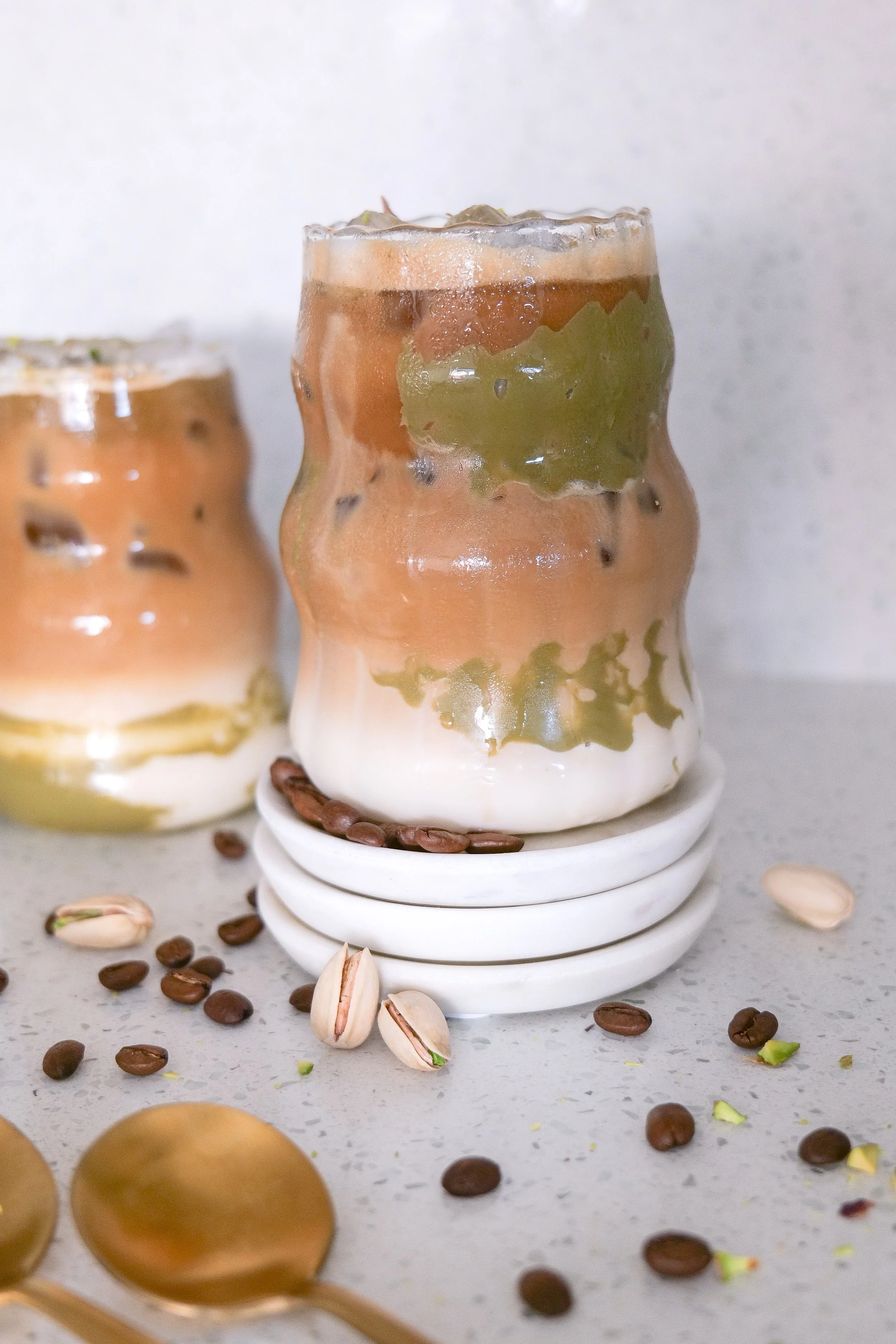 Homemade pistachio coffee drink prepared as an easy iced latte at home.