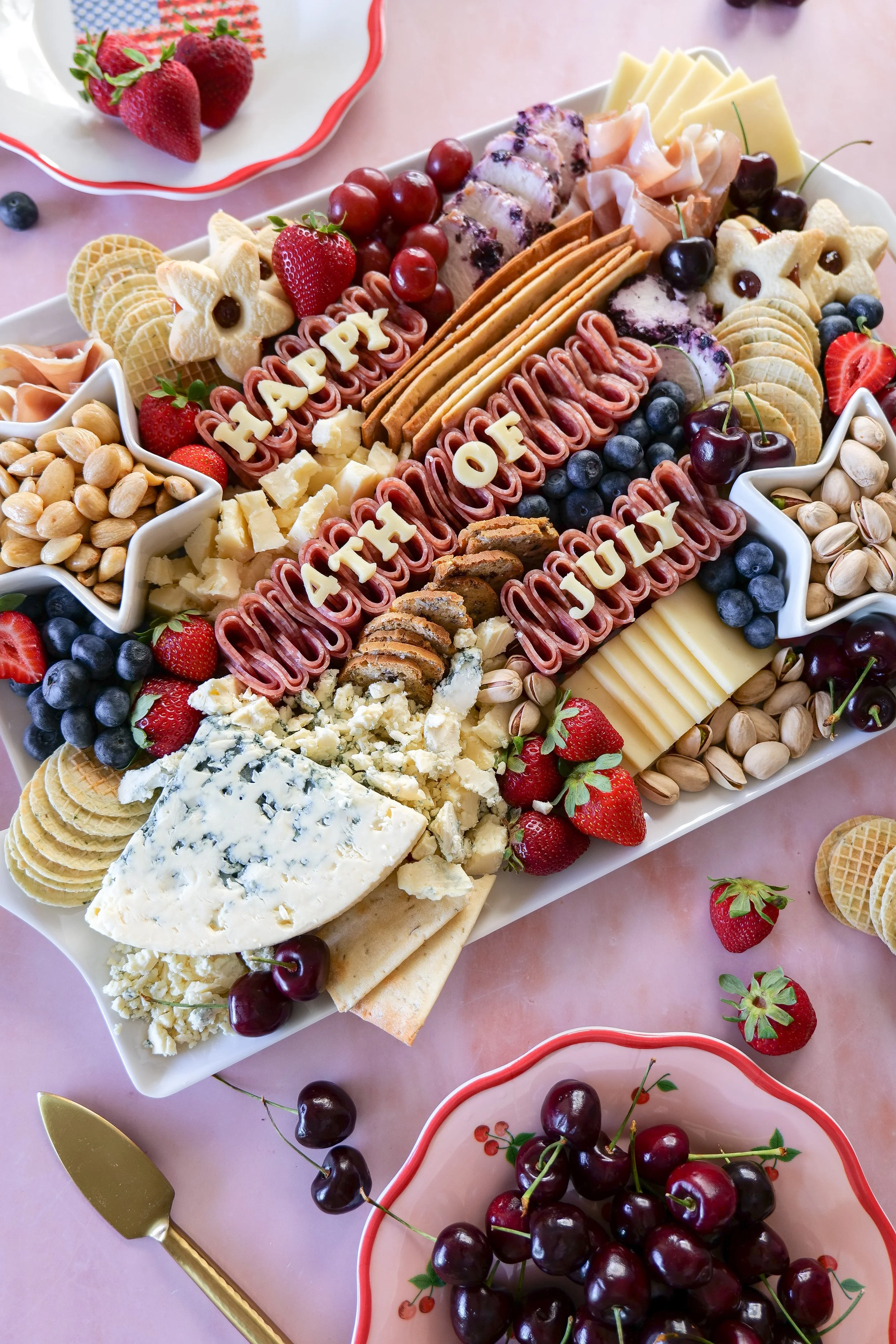 Easy Fourth of July appetizer board filled with cheese, fruit, and crackers.