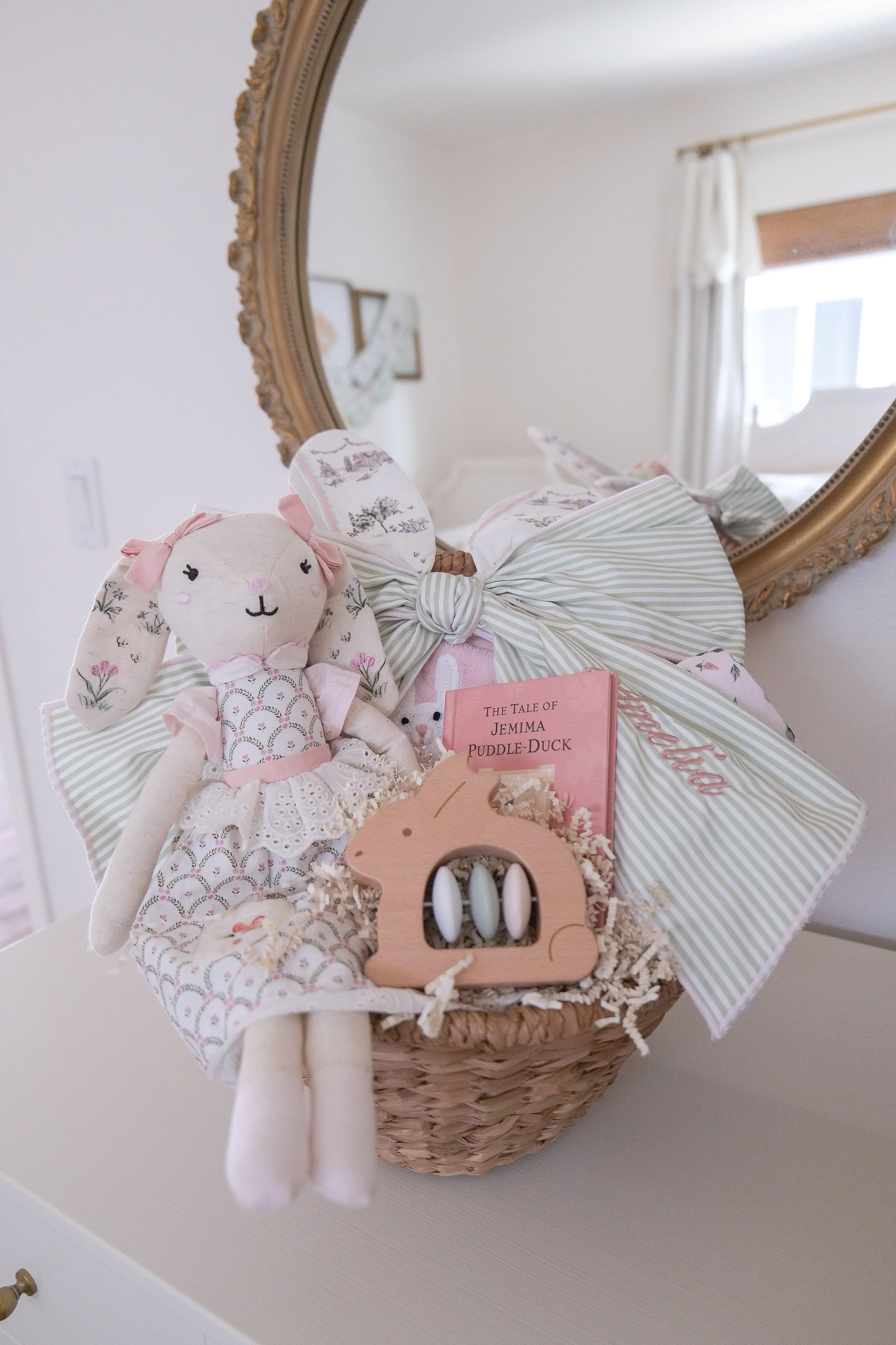 Children's Easter basket filled with colorful toys, books, treats, and Easter gifts.