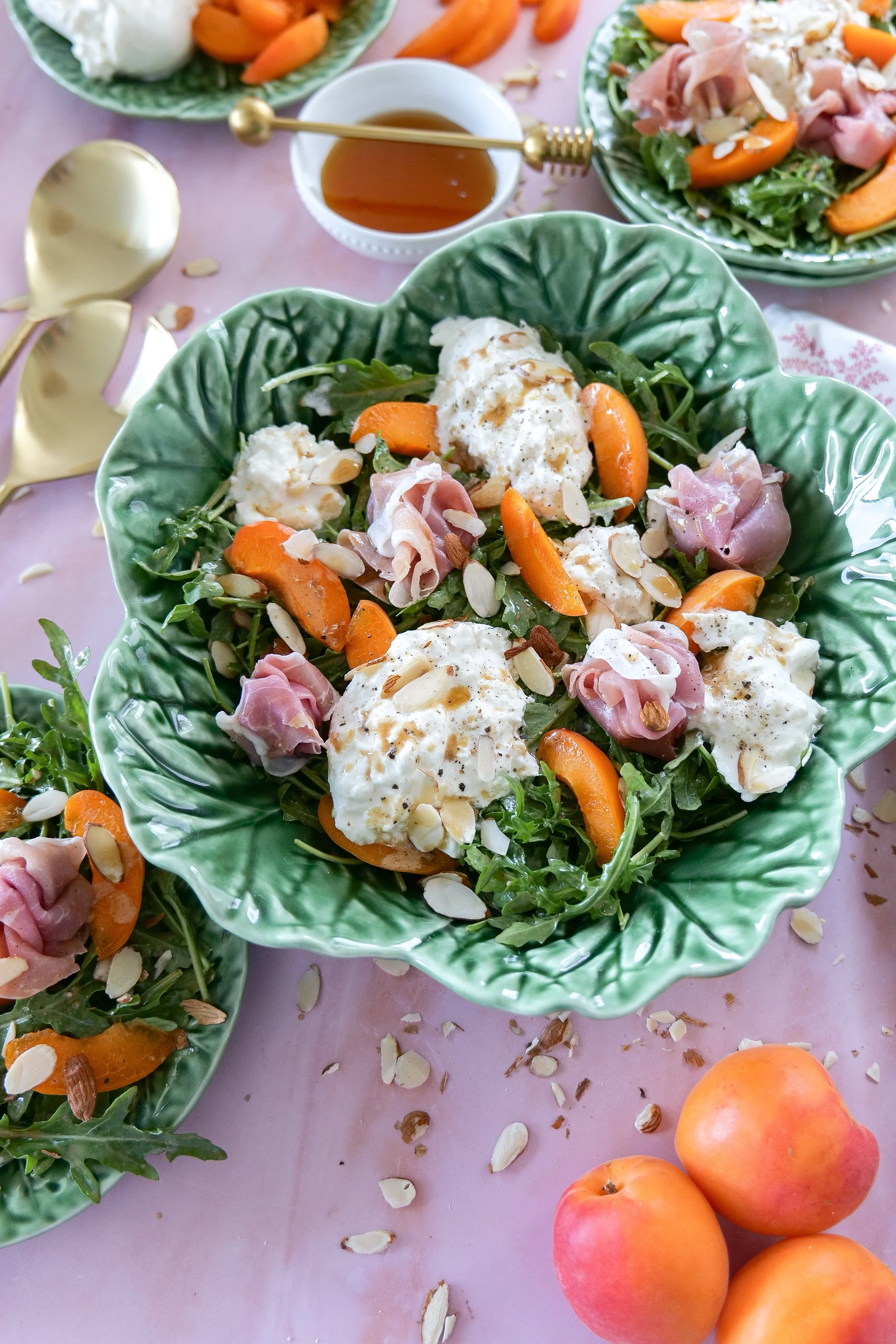 Burrata salad with ripe apricots, prosciutto, and honey balsamic dressing.
