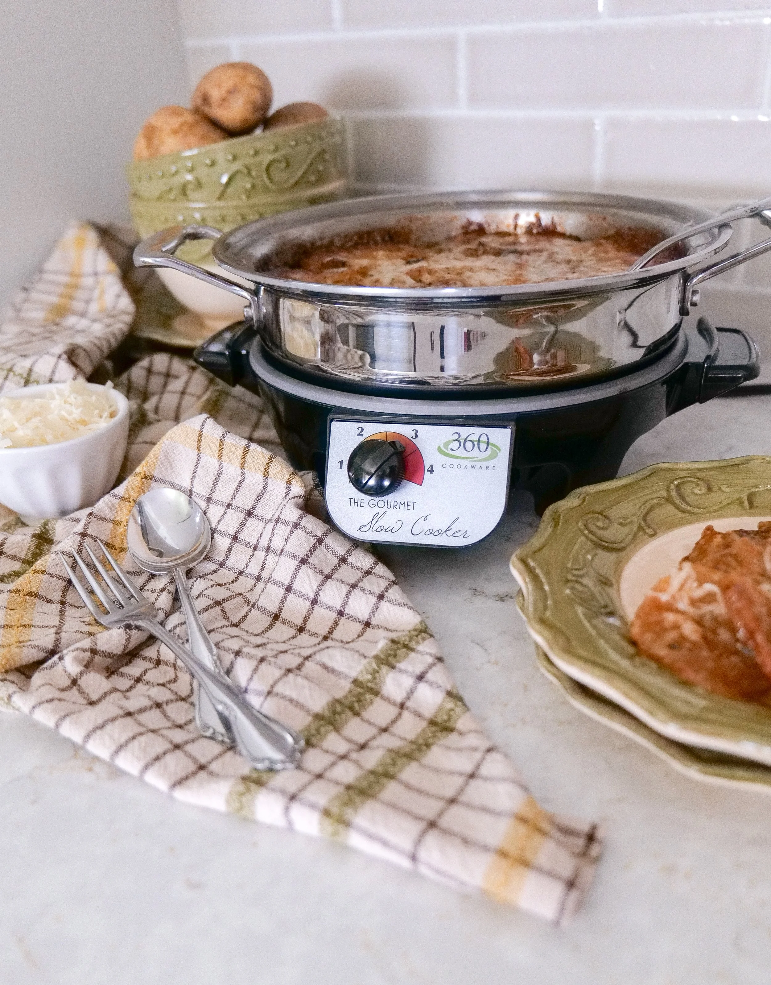 Comfort food scalloped potatoes with rich cream sauce and cheese.