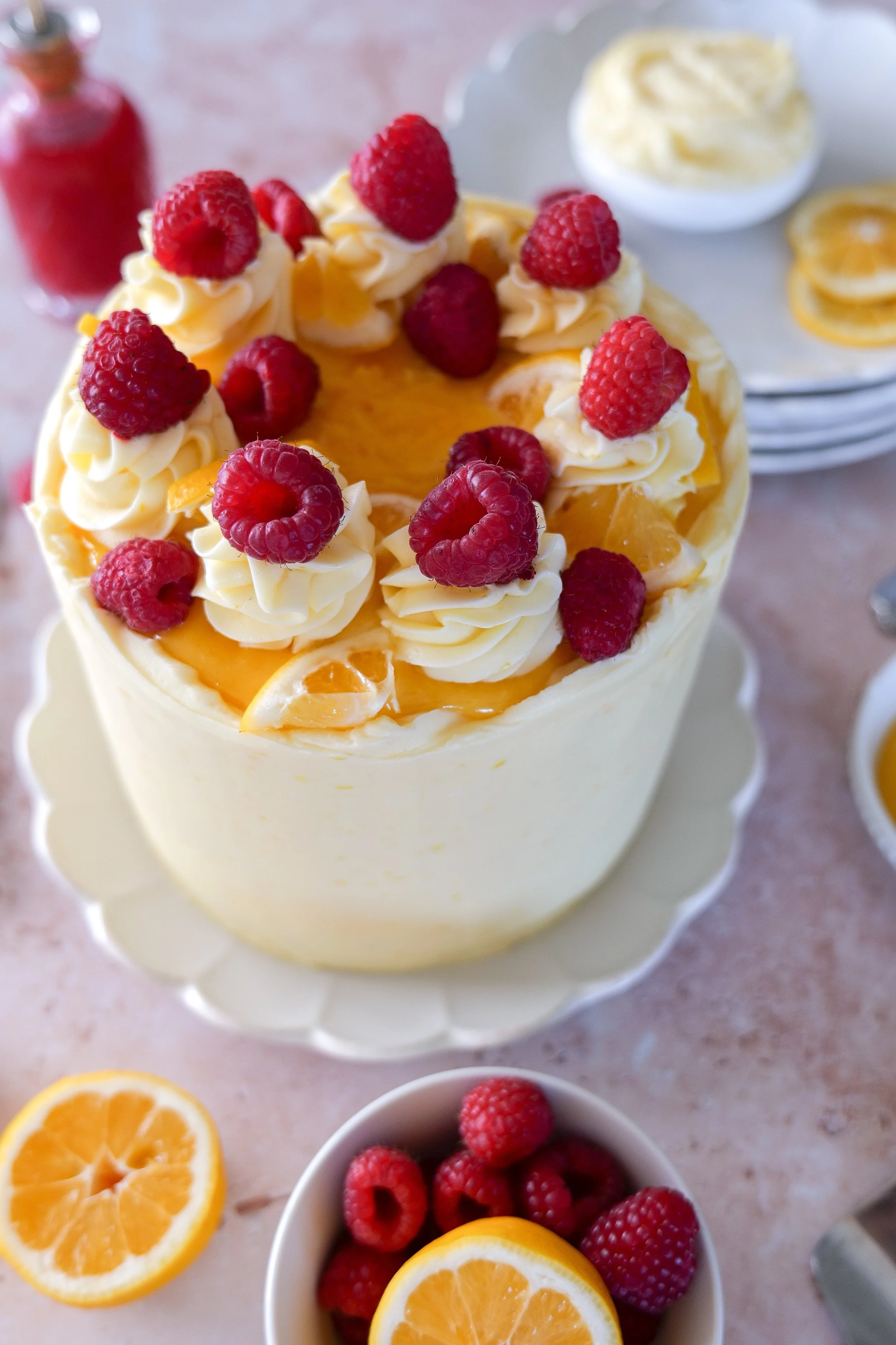 Raspberry lemon dessert cake with soft sponge and buttercream frosting.